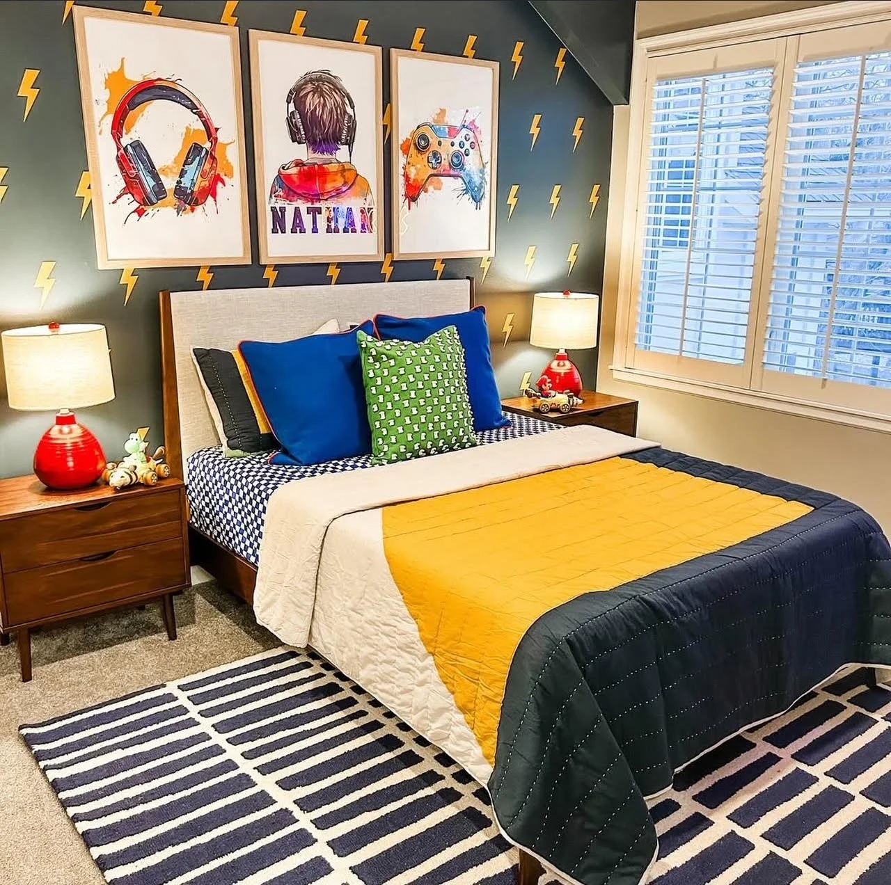 boys bedroom with accent wall, framed art, and fun colors