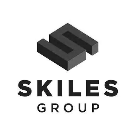 The logo for SKILES GROUP featuring a stylized black 3D geometric shape above the company name.