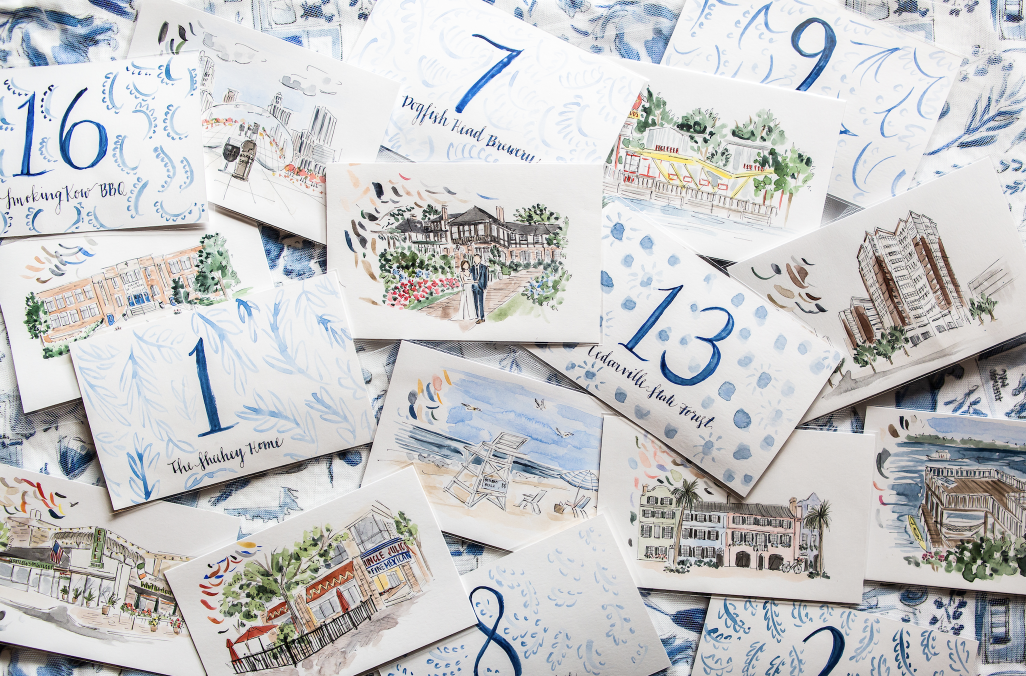  After years of creating wedding paper for other couples, I was so excited to design for my own wedding- the hand-painted table numbers each featured a location of significance for me and my husband&nbsp; 