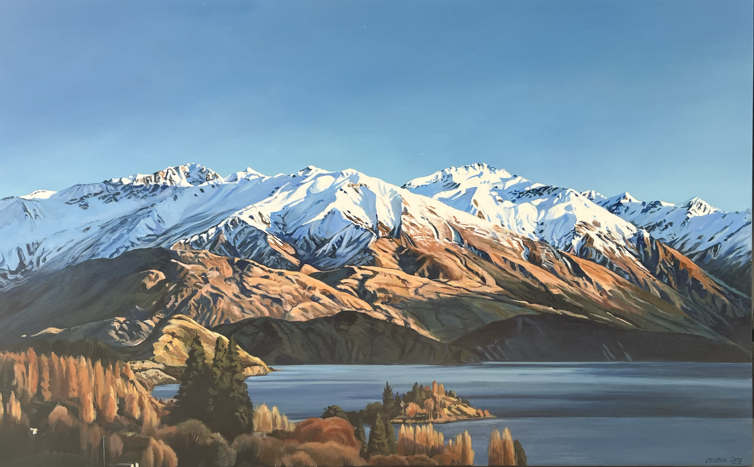 A painted landscape of snow-capped mountains behind a lake, with autumn-colored trees in the foreground.