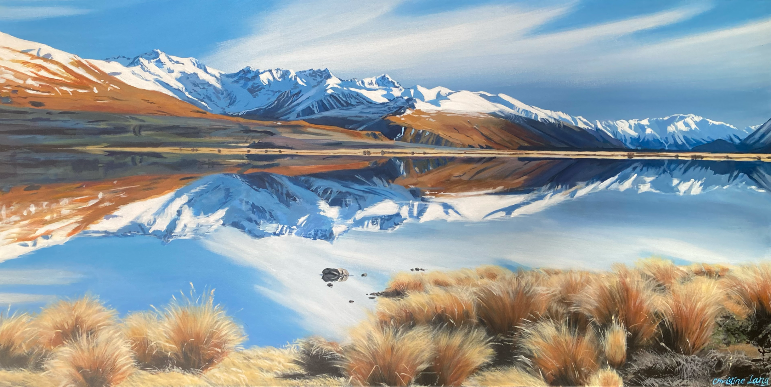 A painting of a scenic mountain landscape with snow-capped peaks reflected in a calm lake, surrounded by golden grass with small rocks in the foreground.