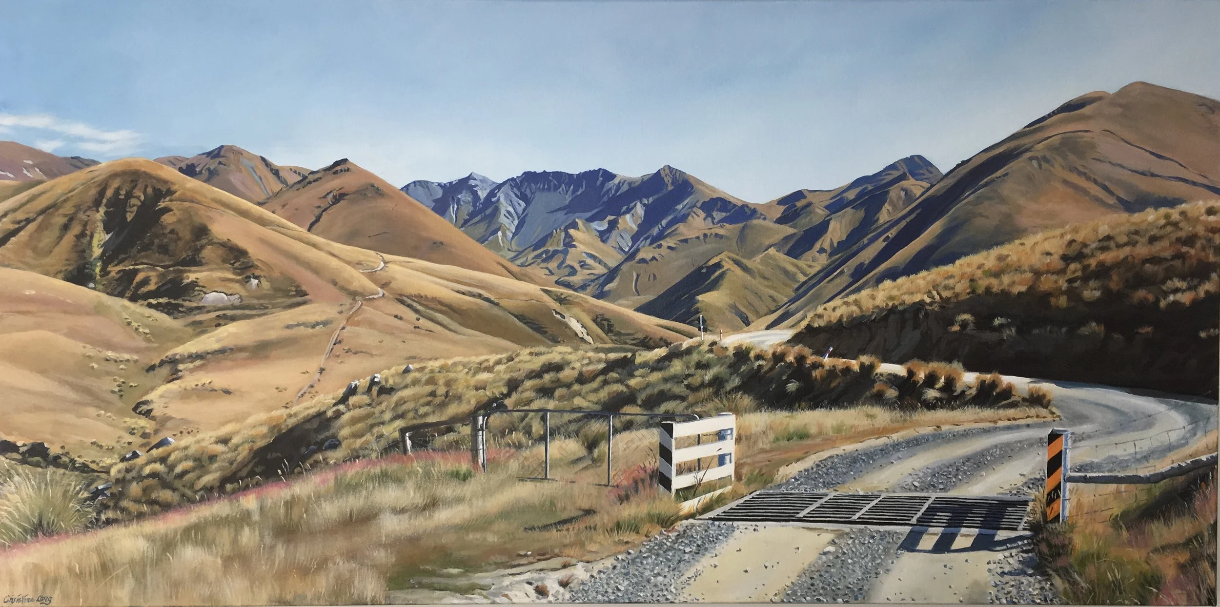 A painted landscape of rolling hills and mountains with a gravel road in the foreground crossing a small bridge, under a clear blue sky.