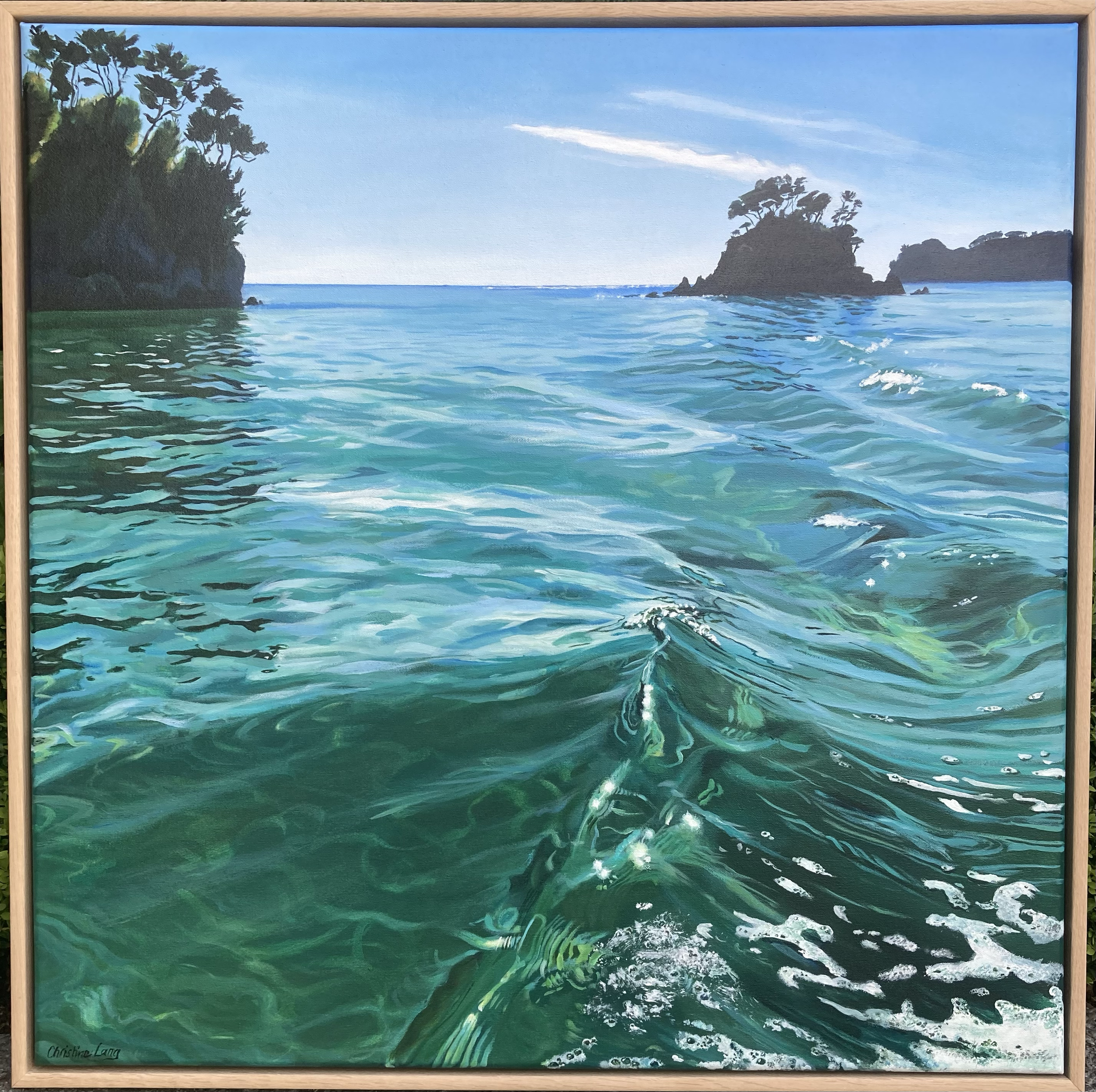 Painting of the ocean with waves, rocky islands with trees in the background, and a clear blue sky.
