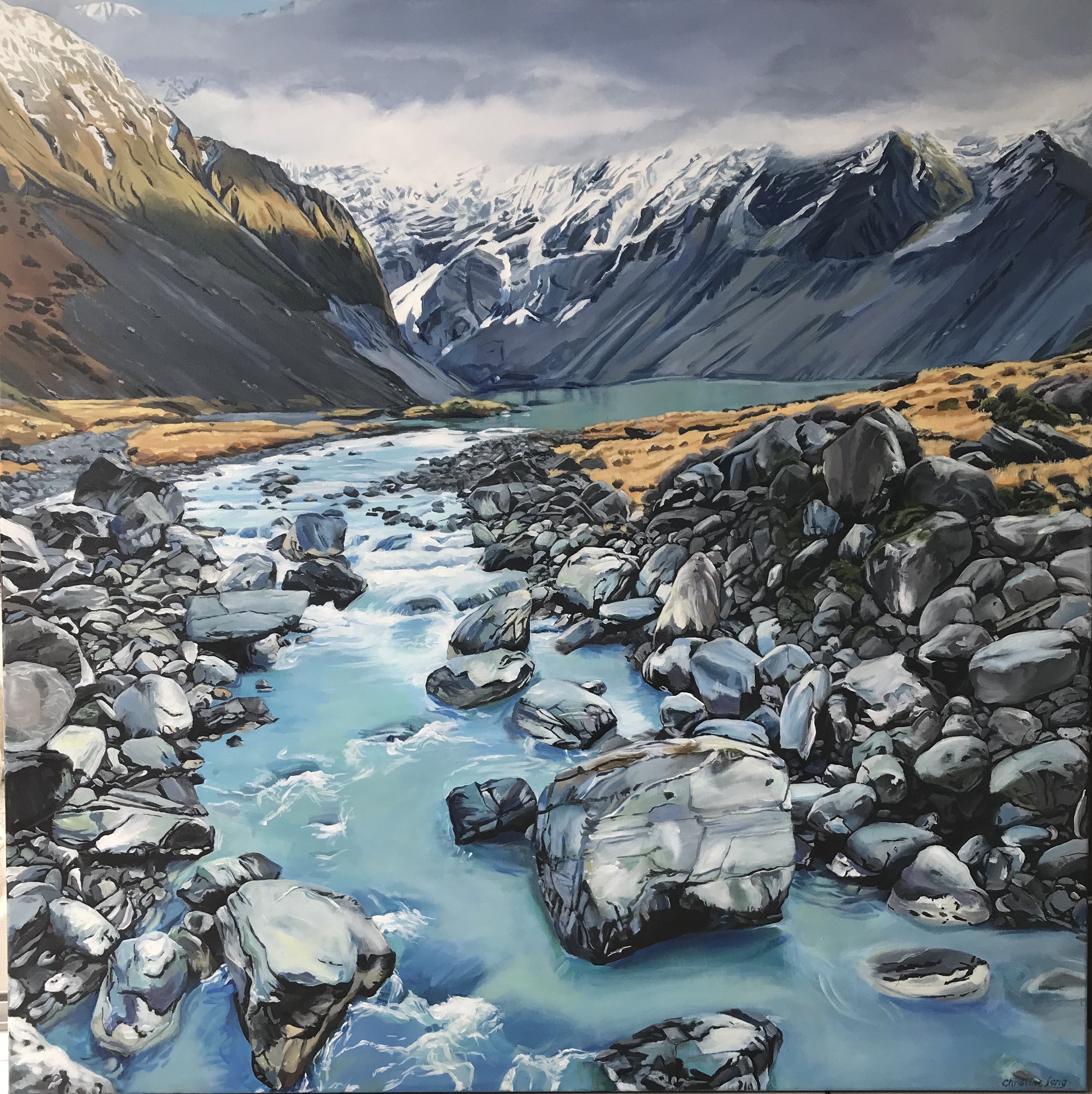 A painting of a mountain valley with a flowing river, rocks, and snow-capped peaks in the background.