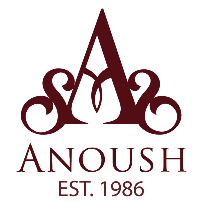 Logo for Anoush featuring a stylized letter A with decorative swirls and the text "ANOUSh EST. 1986" beneath.