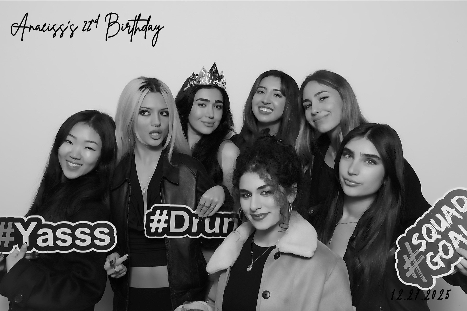 Guests posing at an open air photo booth with custom backdrop by 818 Photo Booth