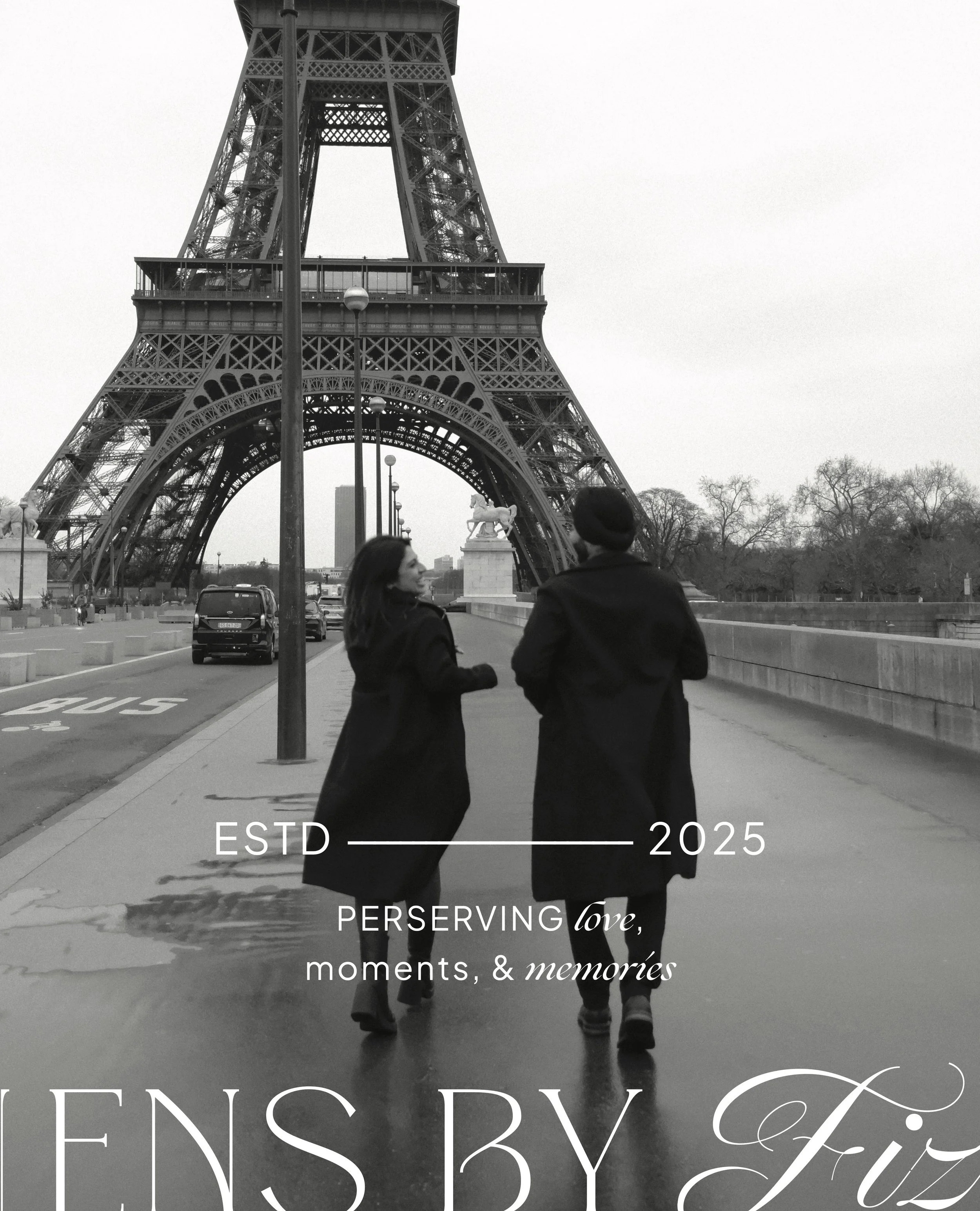 Photo of two people walking near the Eiffel Tower taken by Lens by Fiz