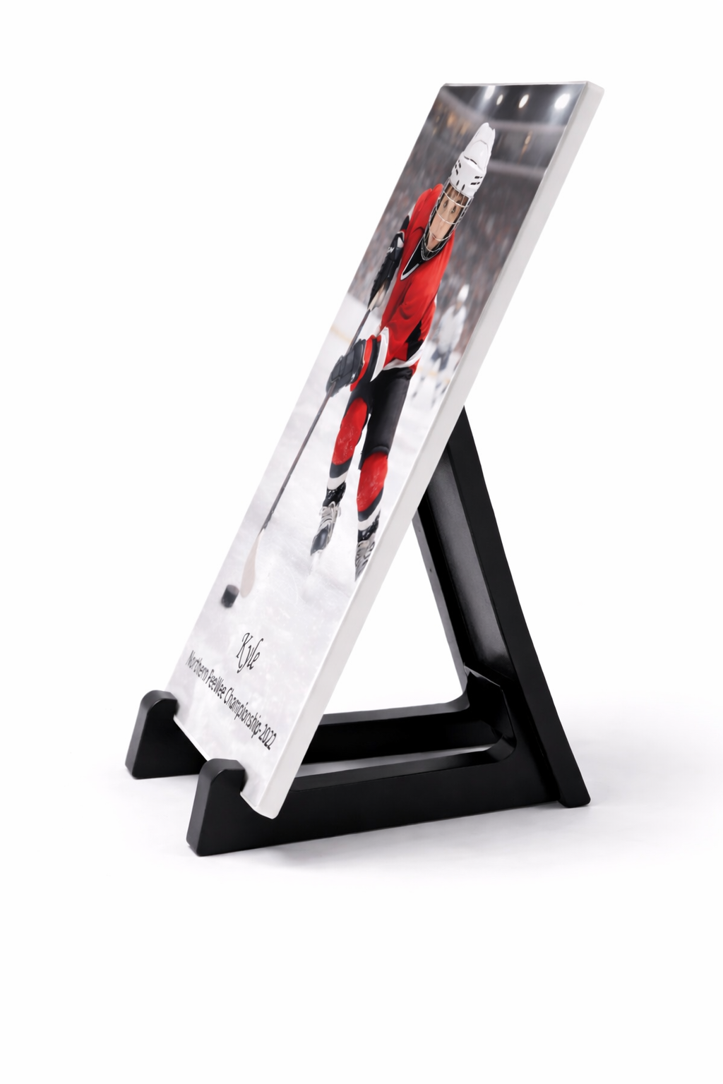 A promotional standee displaying an action shot of a hockey player in a red uniform on ice, with the player's signature and event info at the bottom.