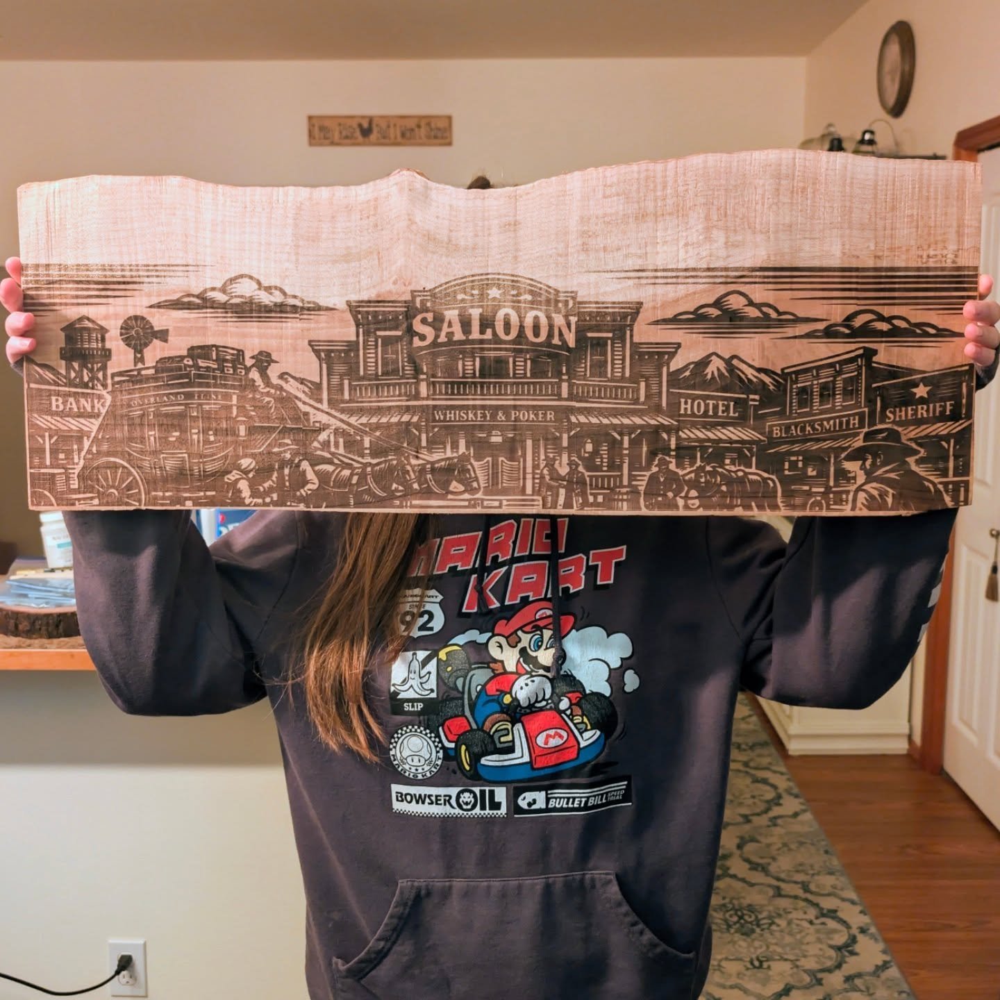 Took a 30&rdquo; maple slab and carved an entire frontier into it &mdash; the saloon, the sheriff&rsquo;s office, the blacksmith, the hotel, even the horses tied out front. Paired with a full set of John Wayne collector knives featuring classic scene