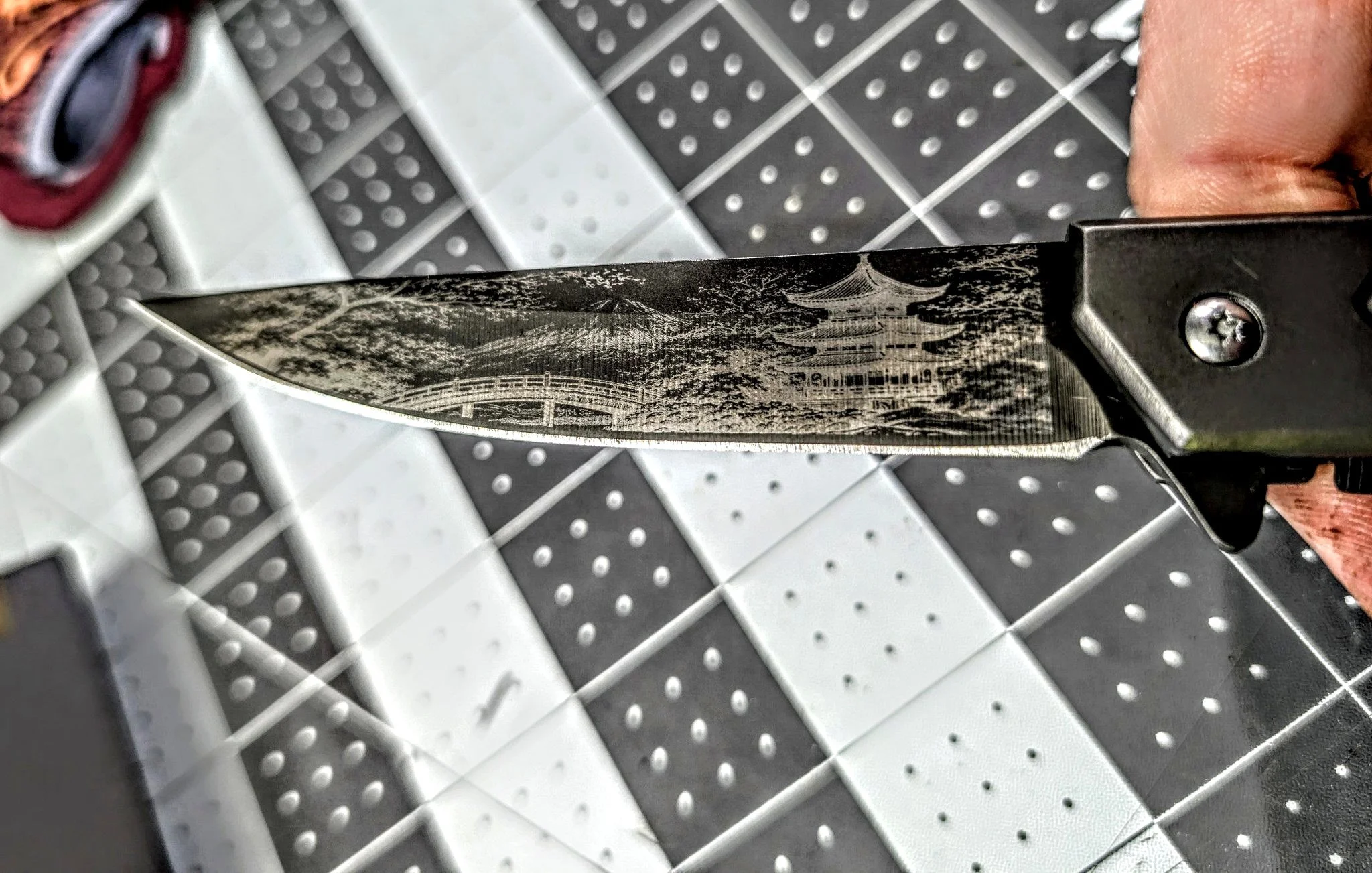 Knife engraved with a Japanese pagoda design