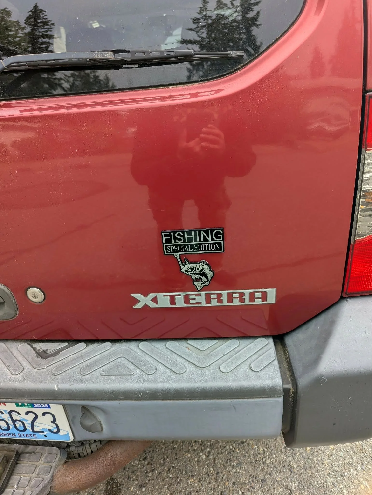 Hand-drawn fishing badge engraved for a Nissan Xterra