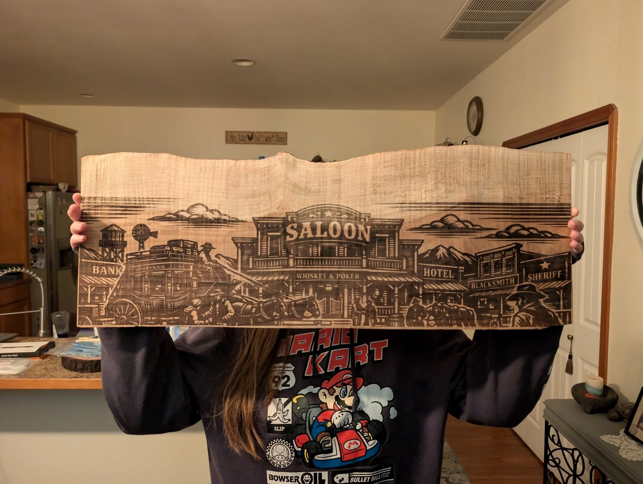 Western scene engraved into a wood slab
