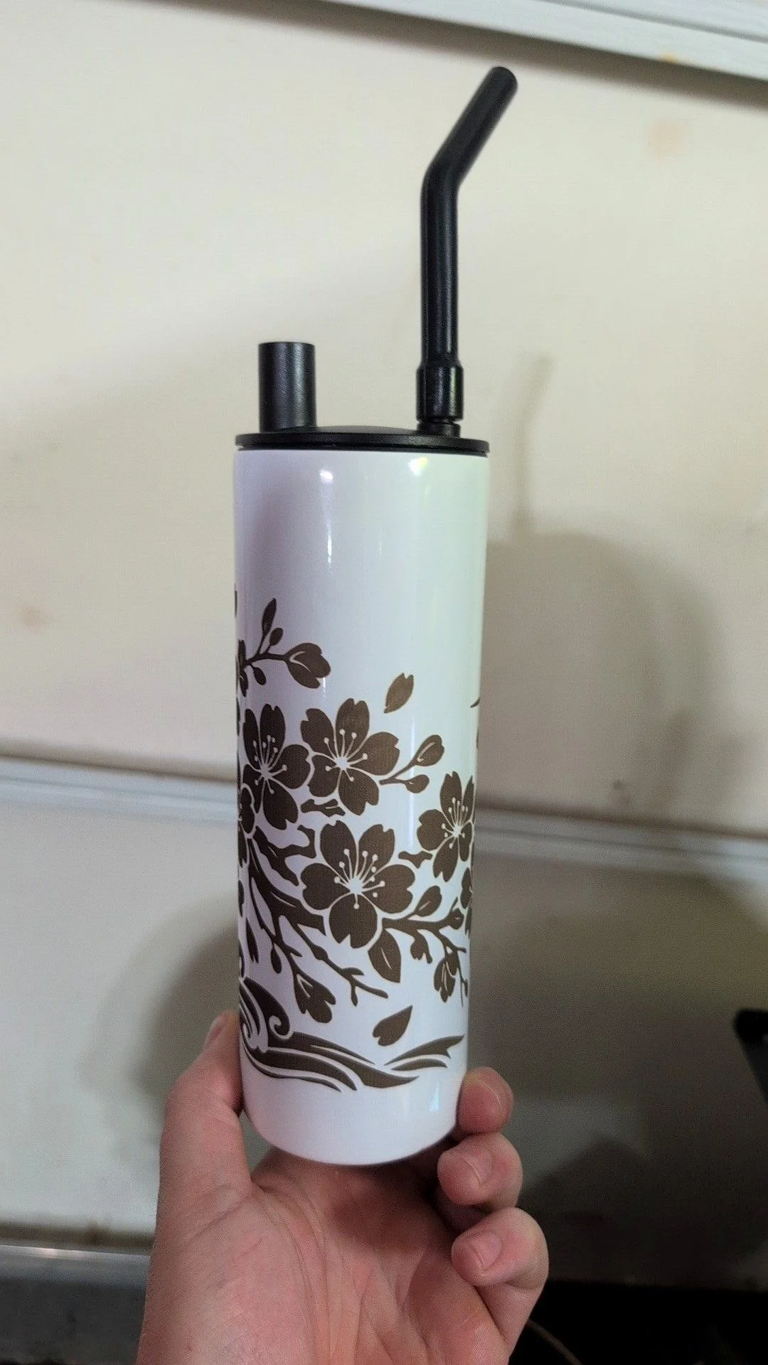 Tumbler engraved with a cherry blossom design