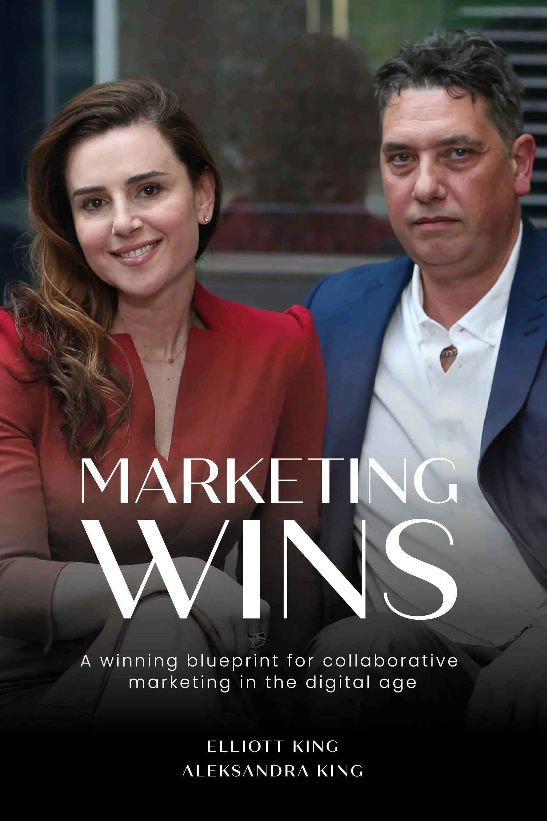 Book cover: “Marketing Wins” — a woman and a man seated together, smiling at the camera — authors Elliott King and Aleksandra King, experts in GEO (Generative Engine Optimisation), AI SEO/AEO, content strategy, and video SEO; subtitle: A winning blue