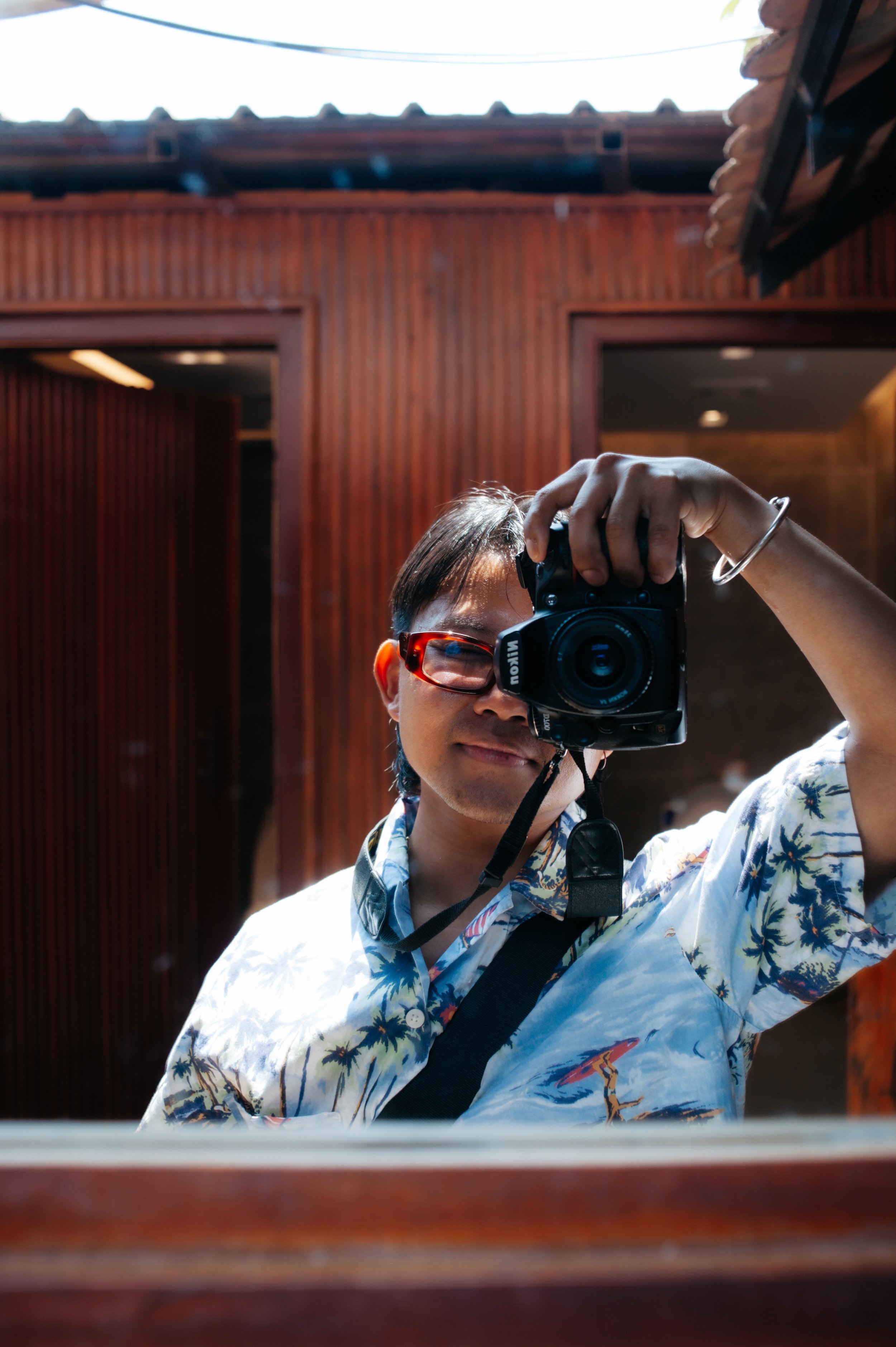 The photographer in the Hawaiian shirt