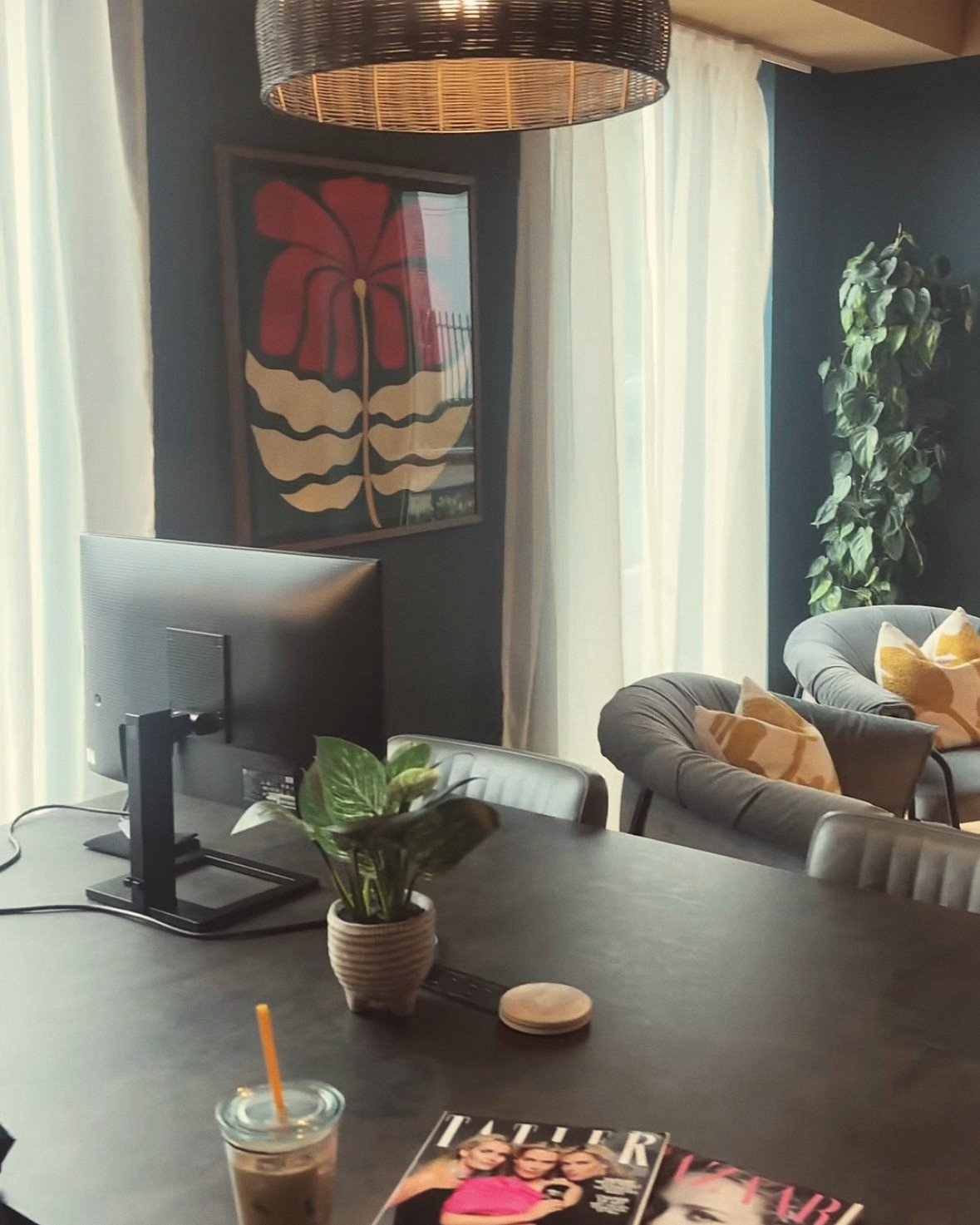 GIGI Marketing workspace with a desk, monitor and plants