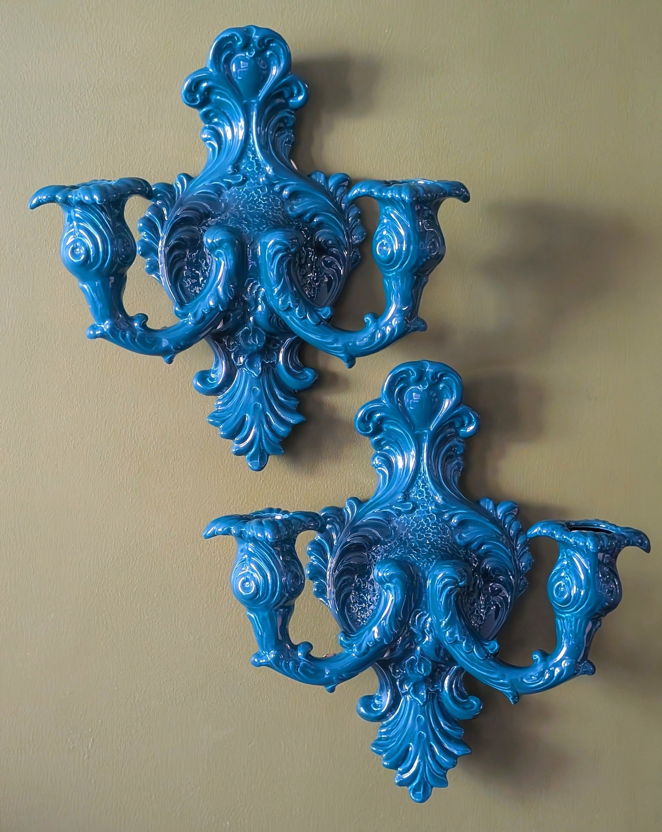 A pair of wall sconces by Rebirth