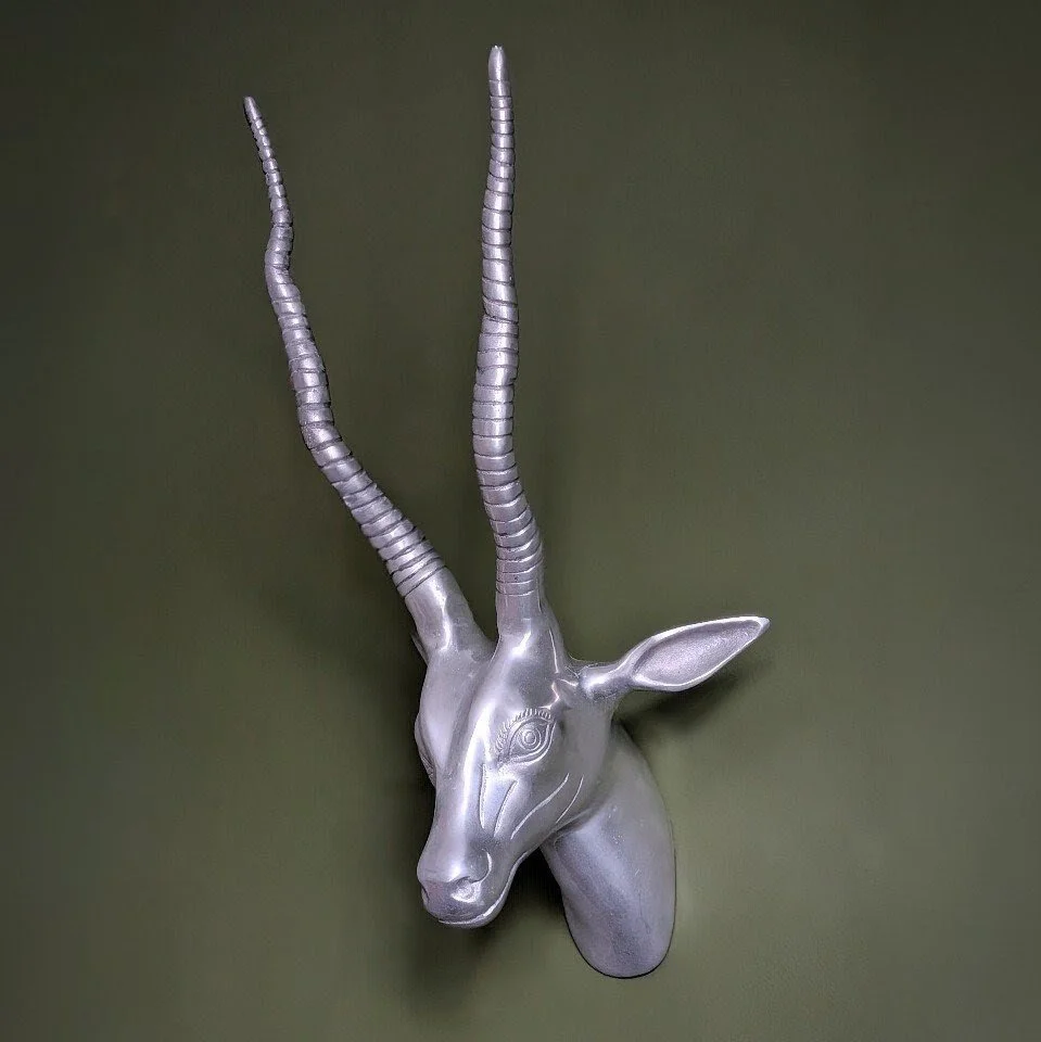 A metal 'trophy' head of a gazelle