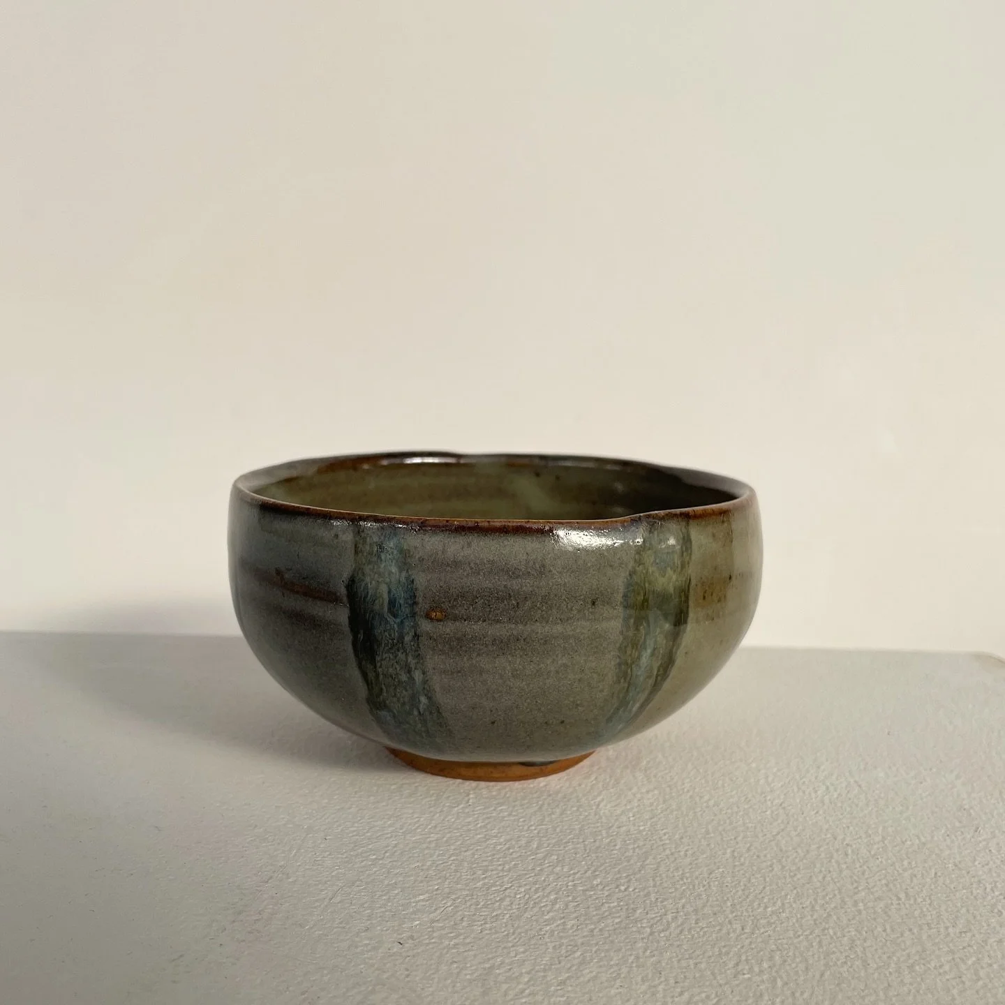 Tea bowl I used as a test tile for layering my two fave gas kiln glazes in a fun new way, what do you think? I think it looks like a melon aha I like the two tone even within the lines where the glaze is thicker and thinner and thus turned either dar