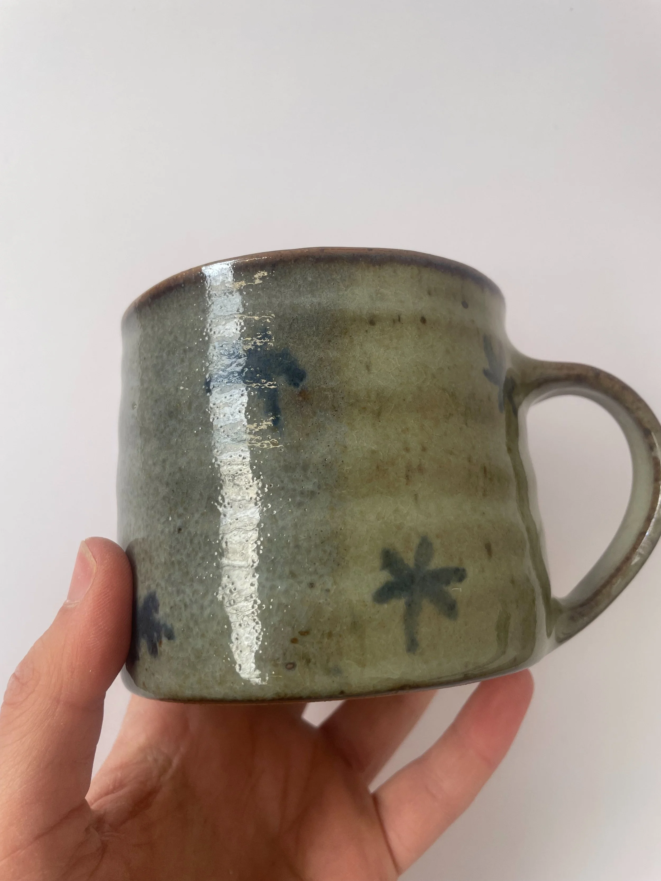 Placed right in the path of the flame in the gas kiln these were kissed by some oxygen during reduction causing patches to turn grey from green. Not what I intended but a nice little gas kiln surprise :) 

#pottery #gasfiring #ceramics #wheelthrownce