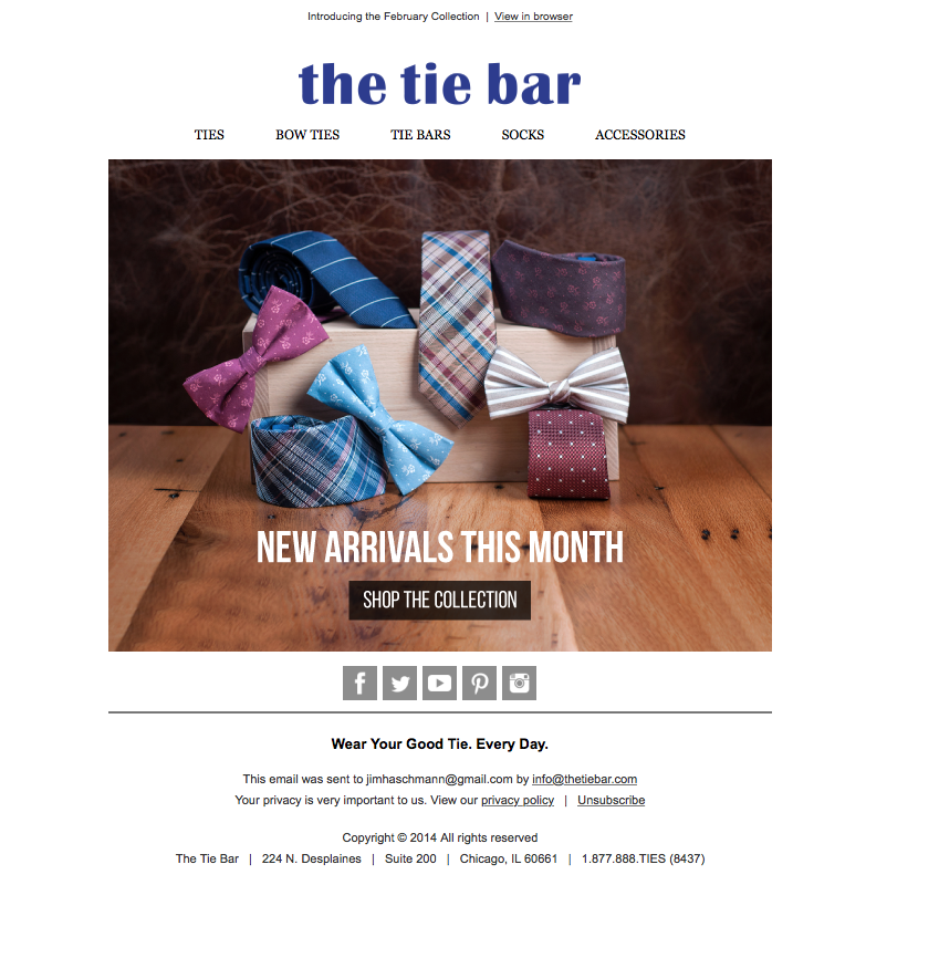 Display of colorful men's ties and bow ties advertised as new arrivals for the month.