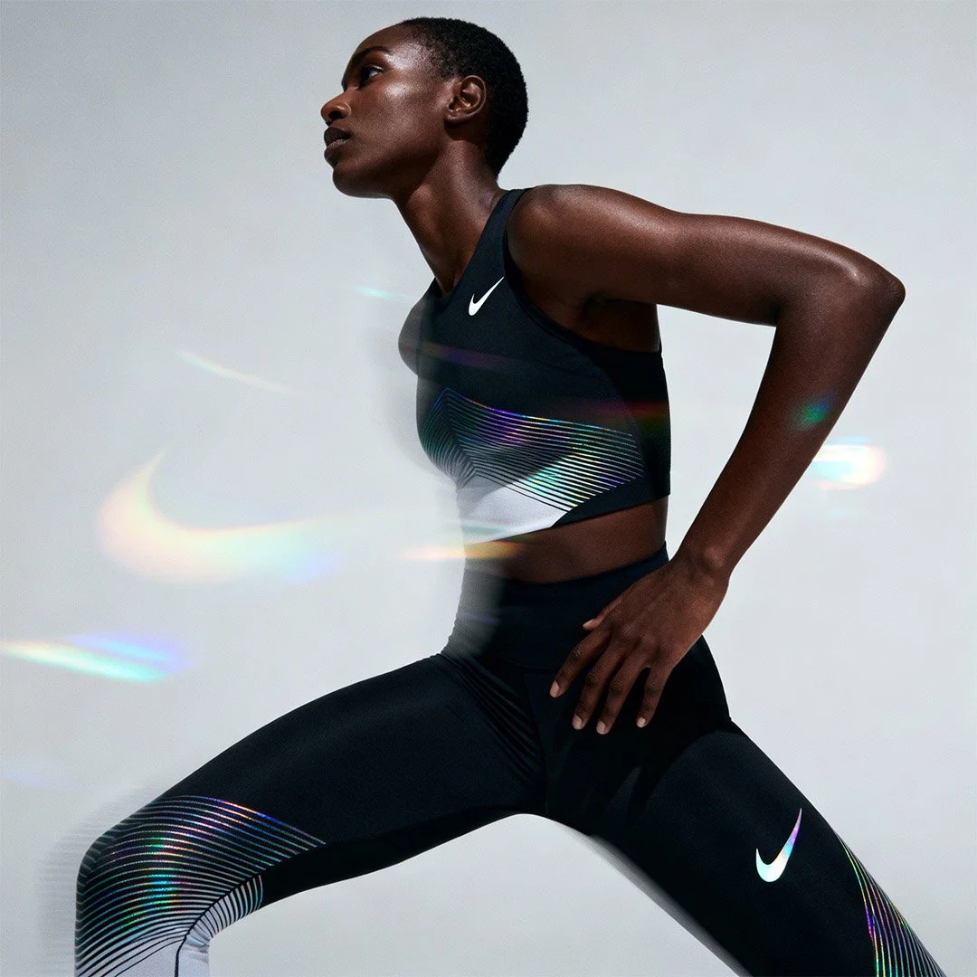 freepik_editorial-fashion-nike-ad-model-in-dynamic-pose-minimalist-abstract-light-grey-background-subtle-soft-rainbow-oil-shimmers_0001-2.jpg