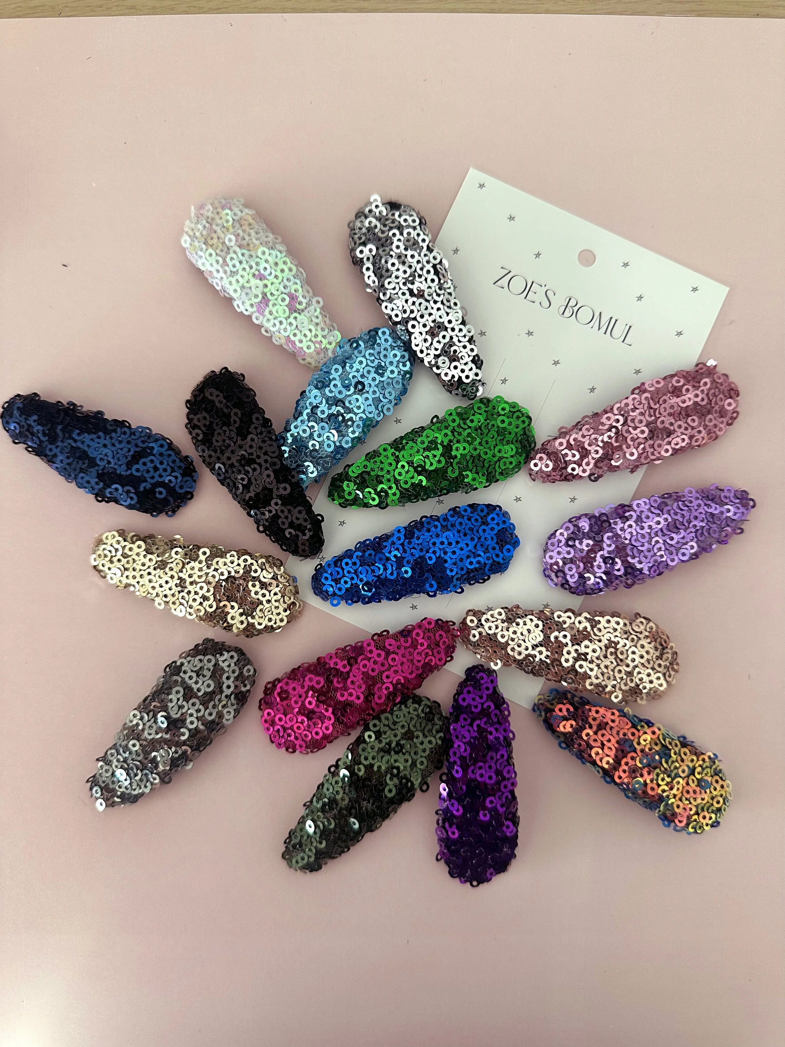 From above hands of unrecognizable woman rubbing aromatic spices into piece of raw meat over parchment paper