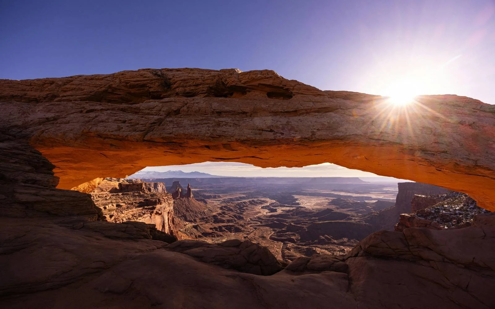 Desert rock arch representing redesigning leadership structure and reducing leadership load.