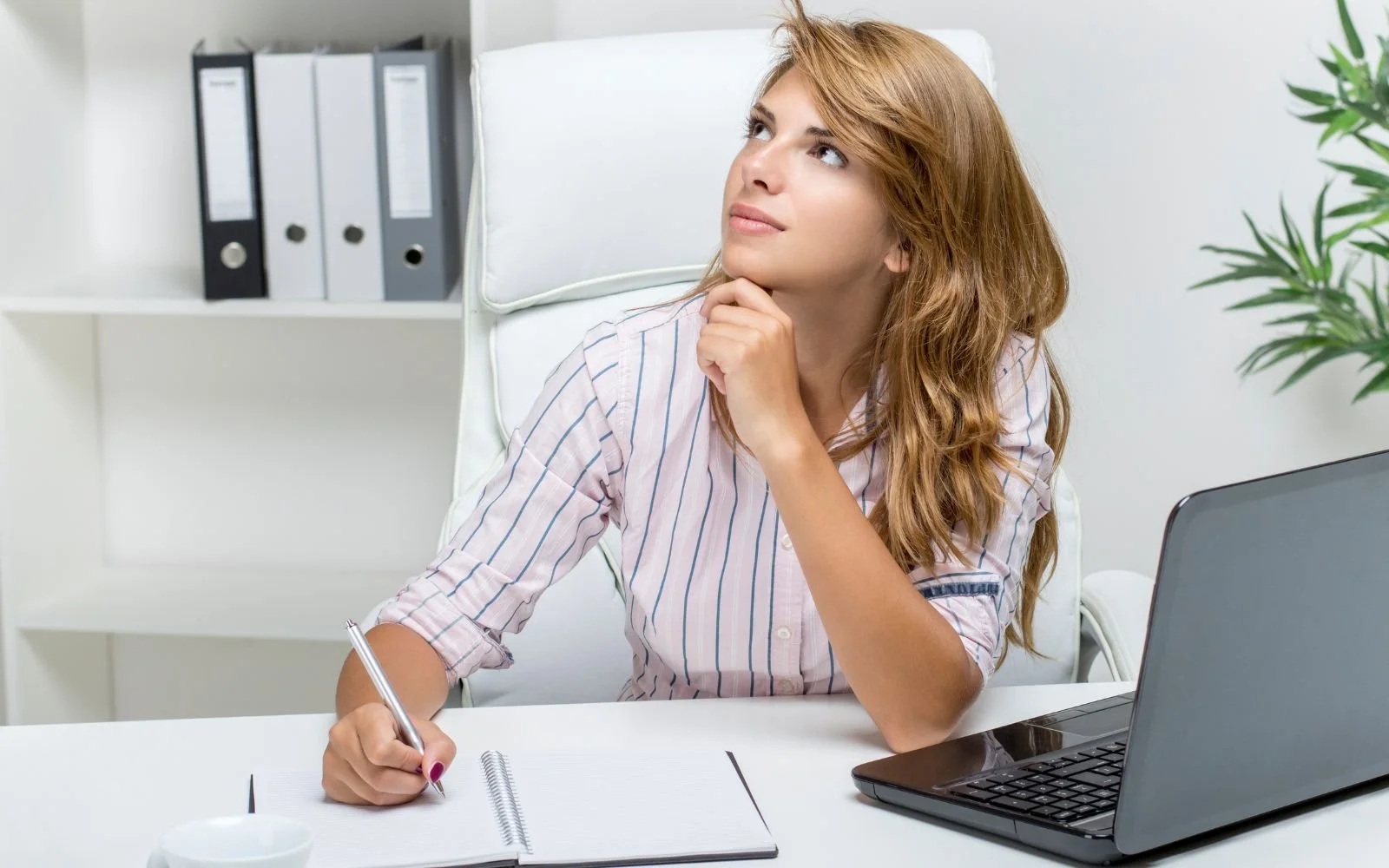 HR leader thinking and taking notes