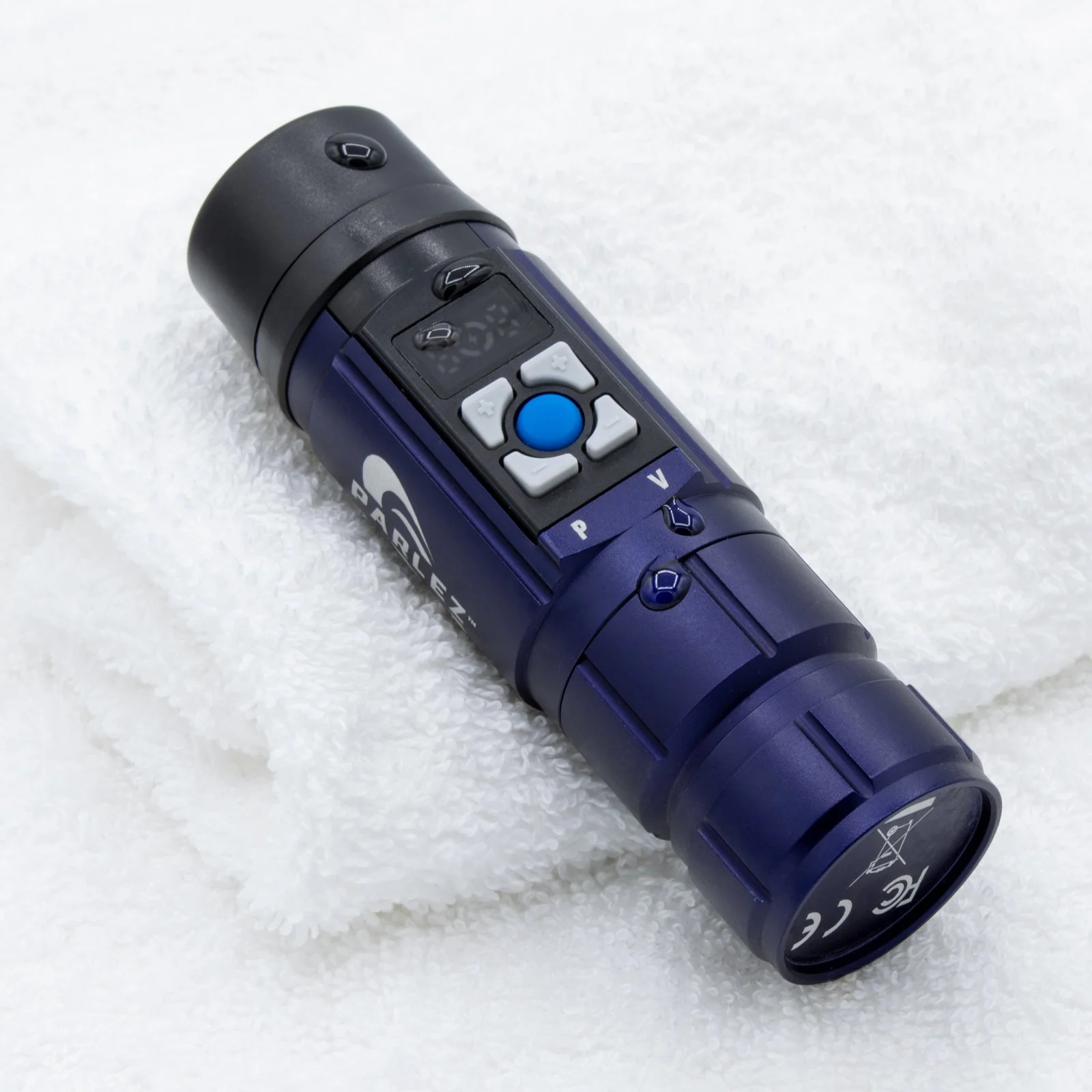 Parlez™ electrolarynx with water droplets on housing demonstrating moisture-resistant design.