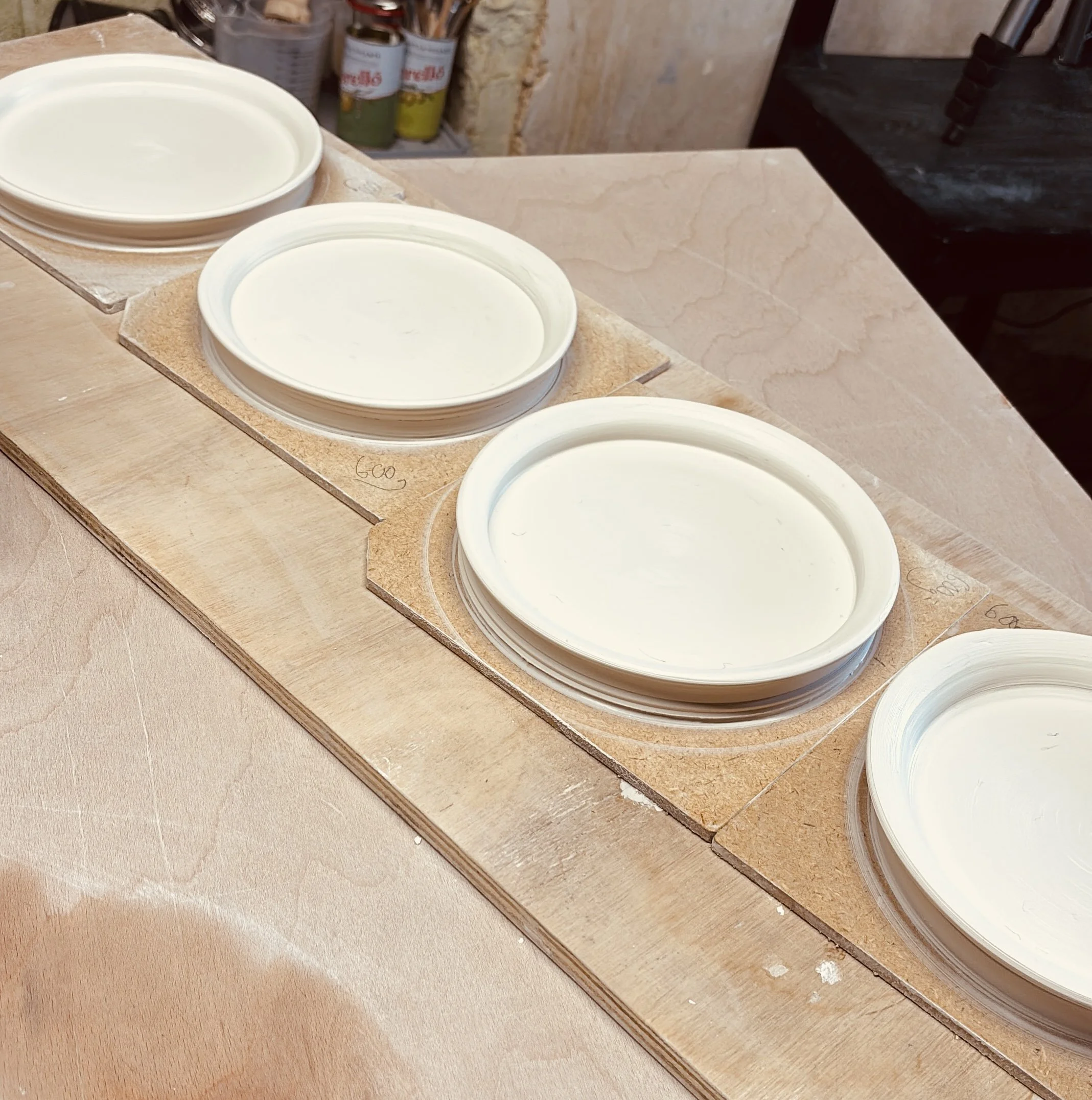 4 handmade porcelain plates for luxury London restaurant made by British porcelain studio FOUND