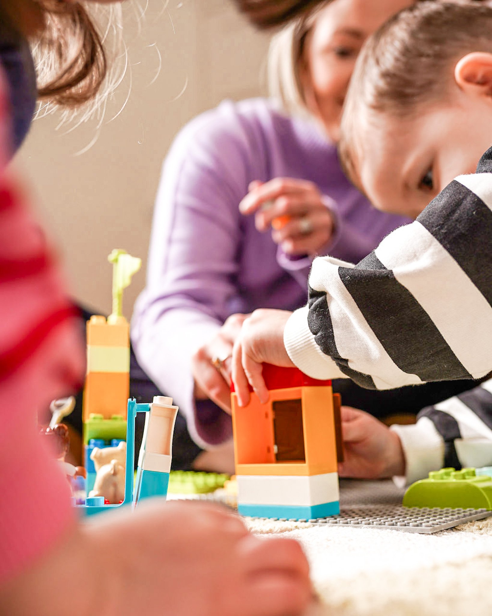 Educational psychologist working with child and parent during assessment session in Dumfries Scotland