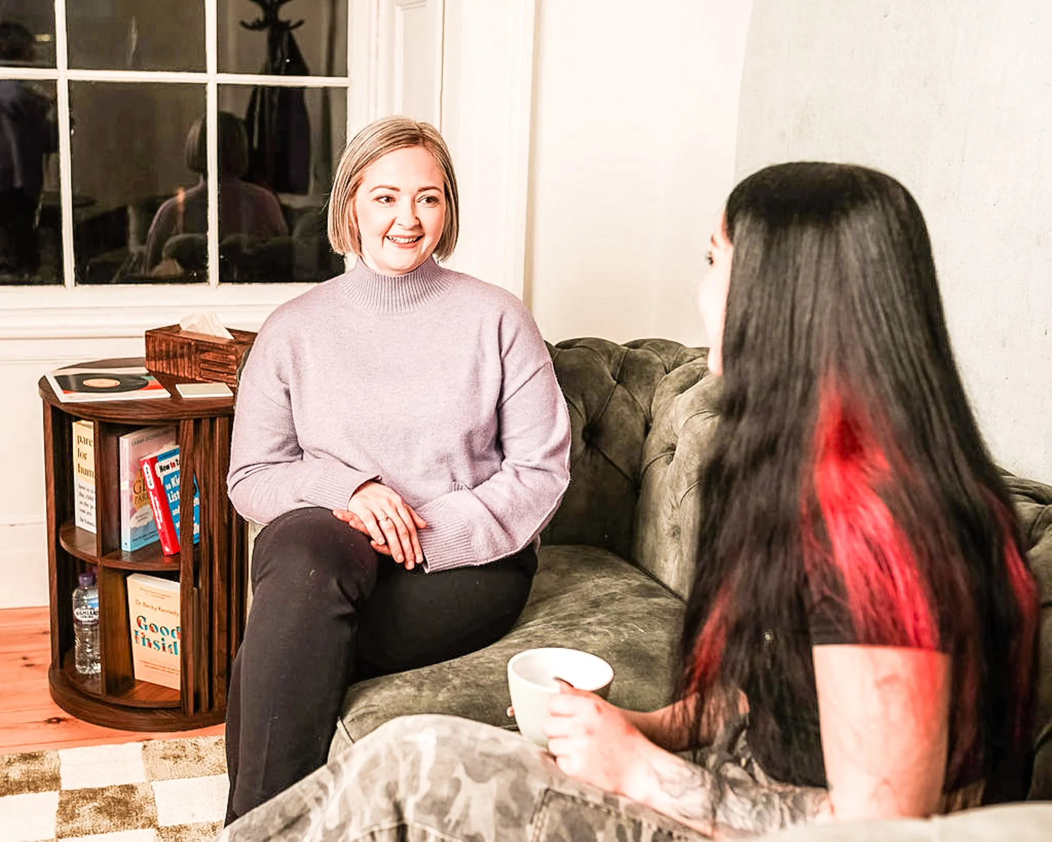Parent and child receiving educational psychology consultation in a calm home setting