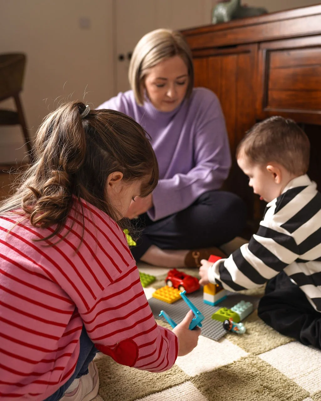 Parent and child receiving educational psychology consultation in a calm home setting