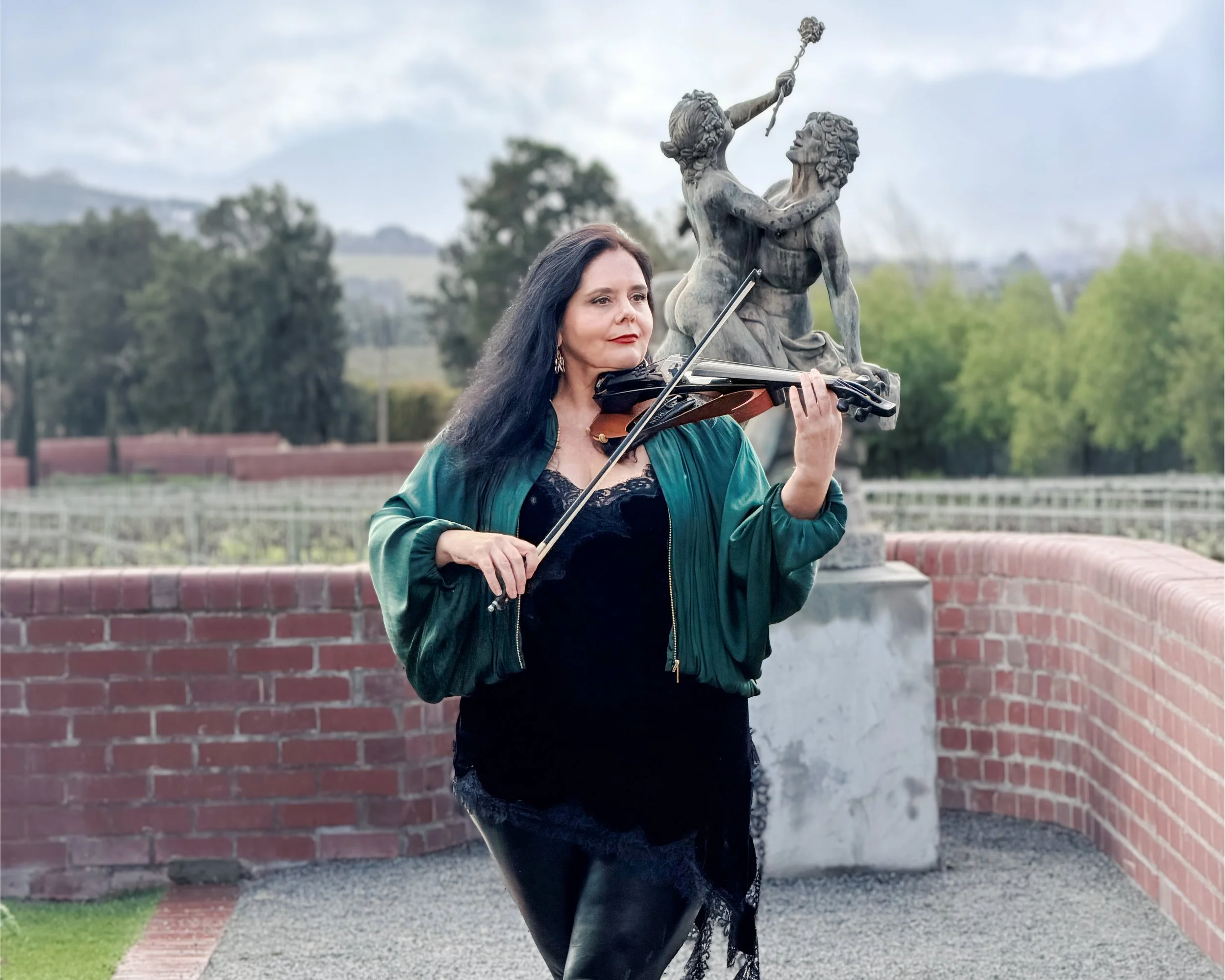 Larah Eksteen with electric violin at an oceanfront private event in Cape Town, South Africa