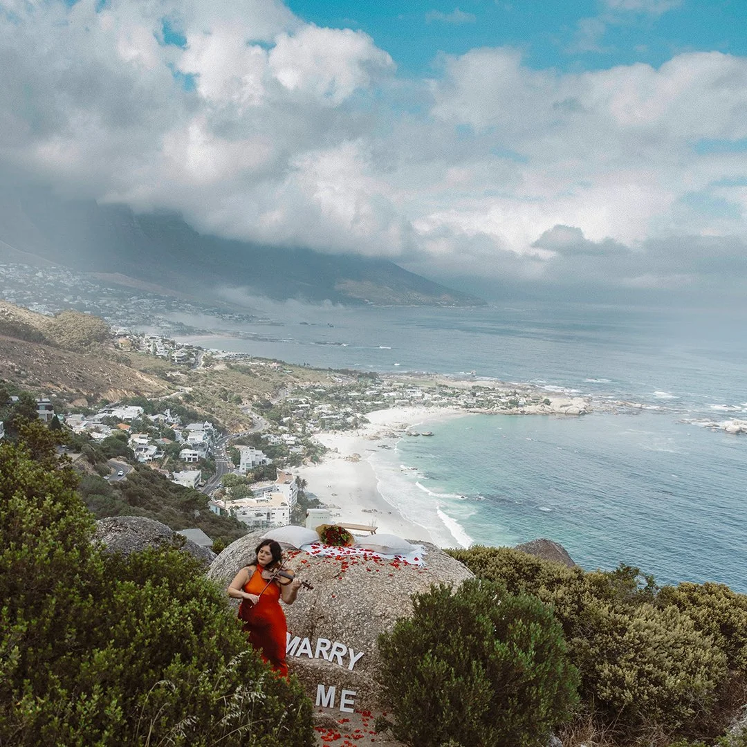 Larah Eksteen performing live violin overlooking Camps Bay and the Atlantic Ocean