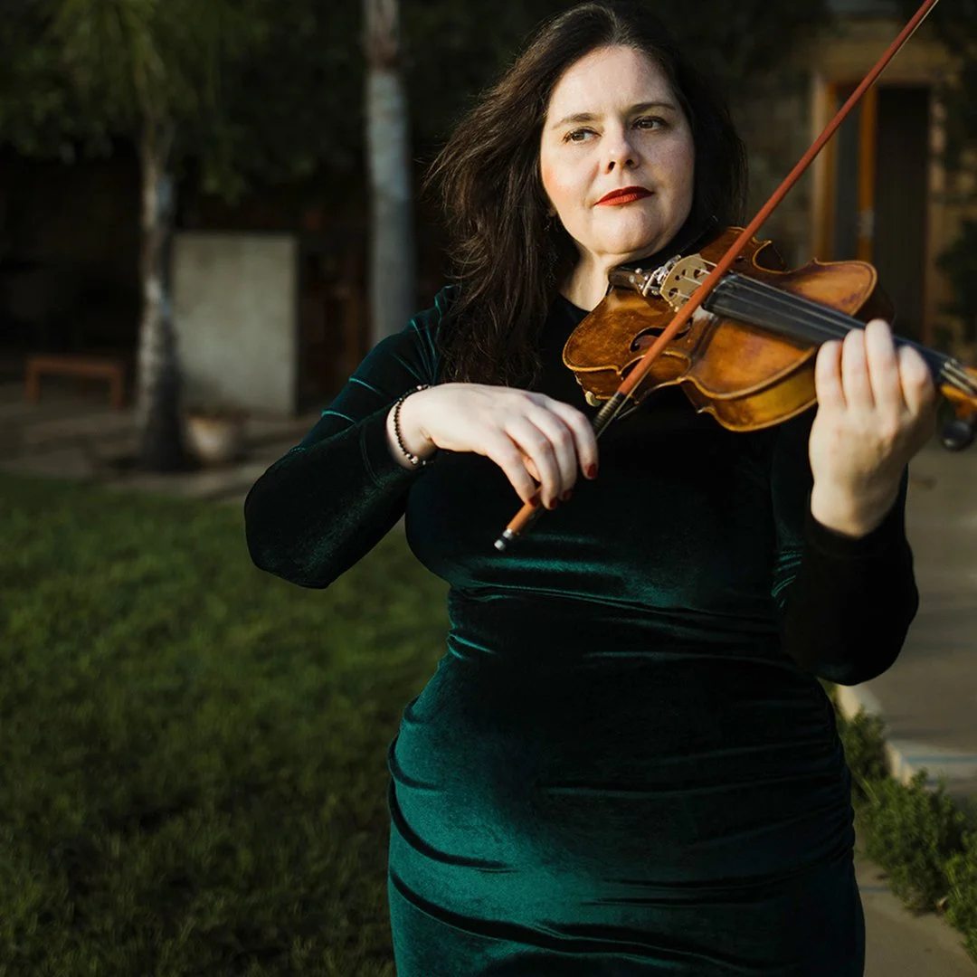 Live violin performance during a sunset proposal at 21 Nettleton Road