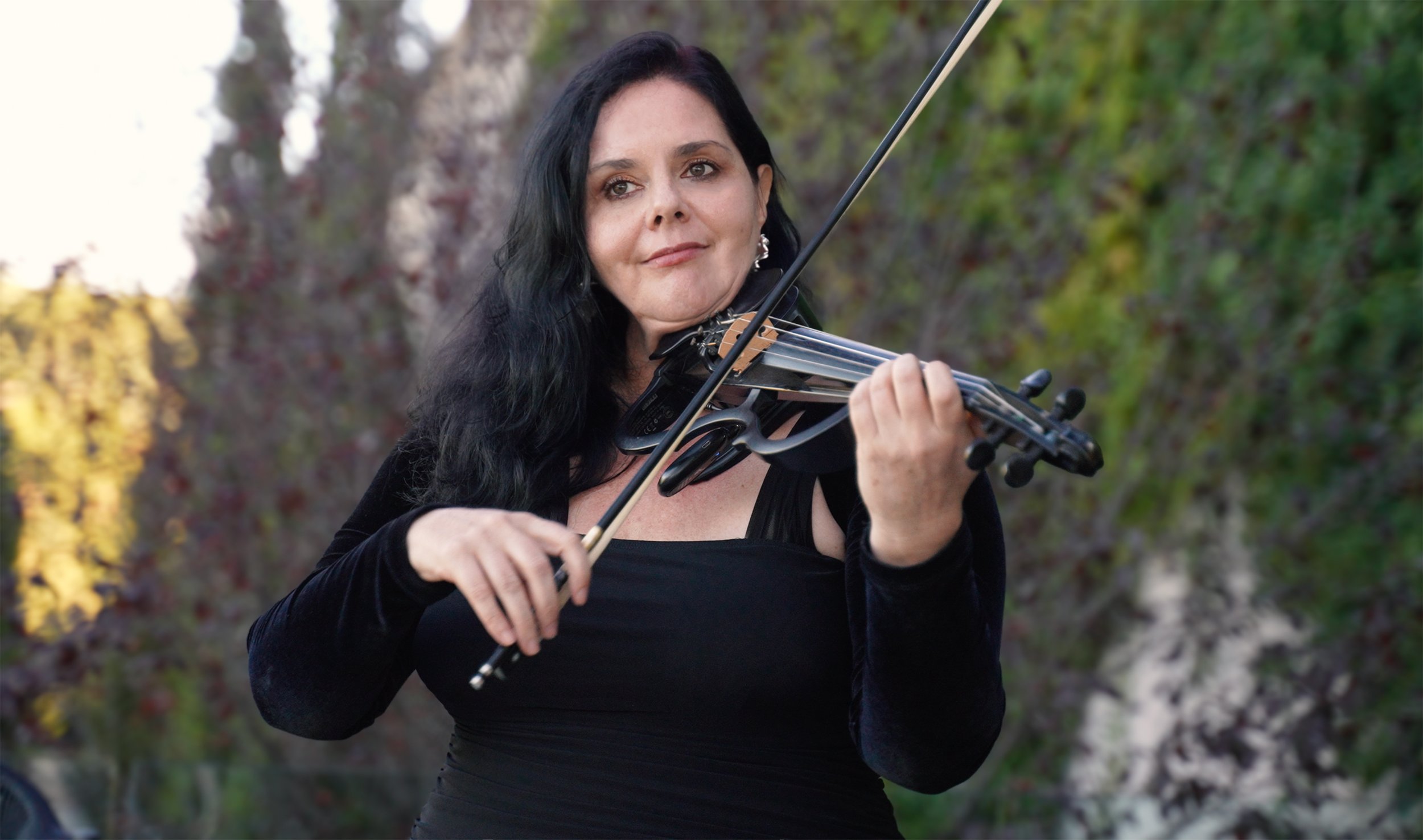 Larah Eksteen, Cape Town violinist, performing at Quoin Rock for a Standard Bank executive event in the heart of the Cape Winelands.