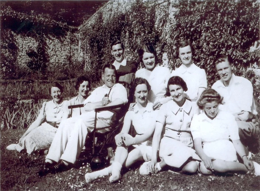 group of people relaxing in garden