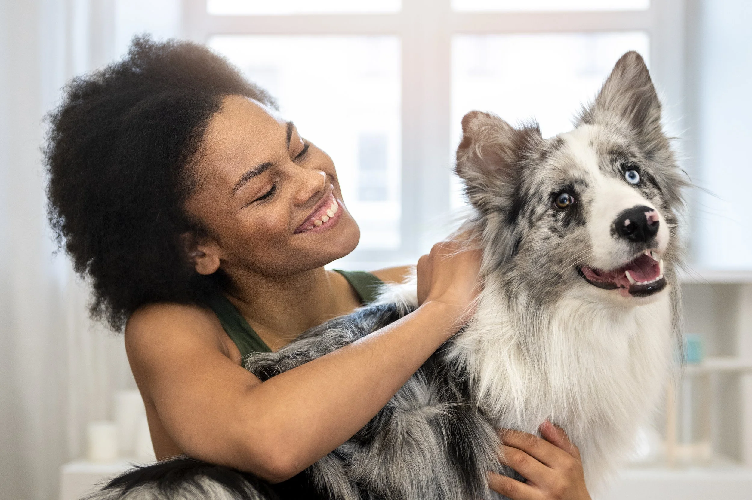 person-doing-yoga-accompanied-by-her-pet.jpg