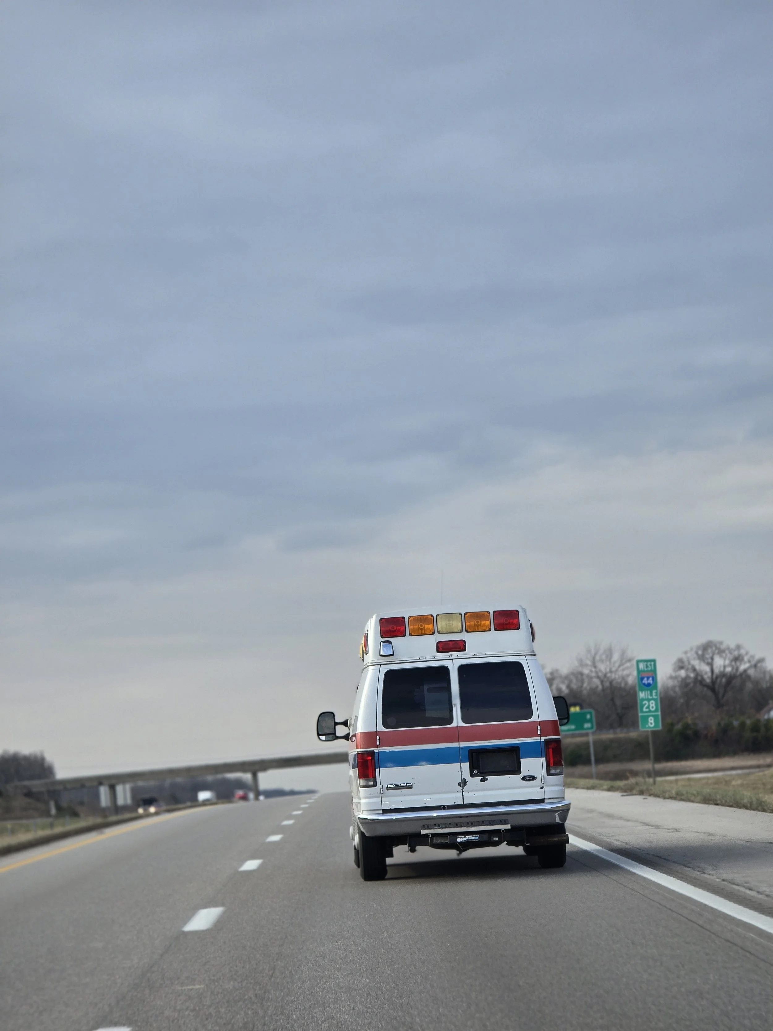 Fire On The Ridge pepper jelly ambulance traveling the highway – behind the scenes of our handmade pepper jelly brand in Arkansas.