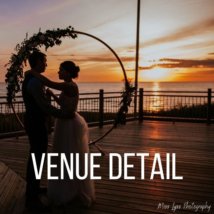 Silhouette of a couple dancing at sunset on a wooden deck with ocean view, accompanied by a floral arch. Text overlay says 'VENUE DETAIL' and a small signature reads 'Miss Lyss Photography.'