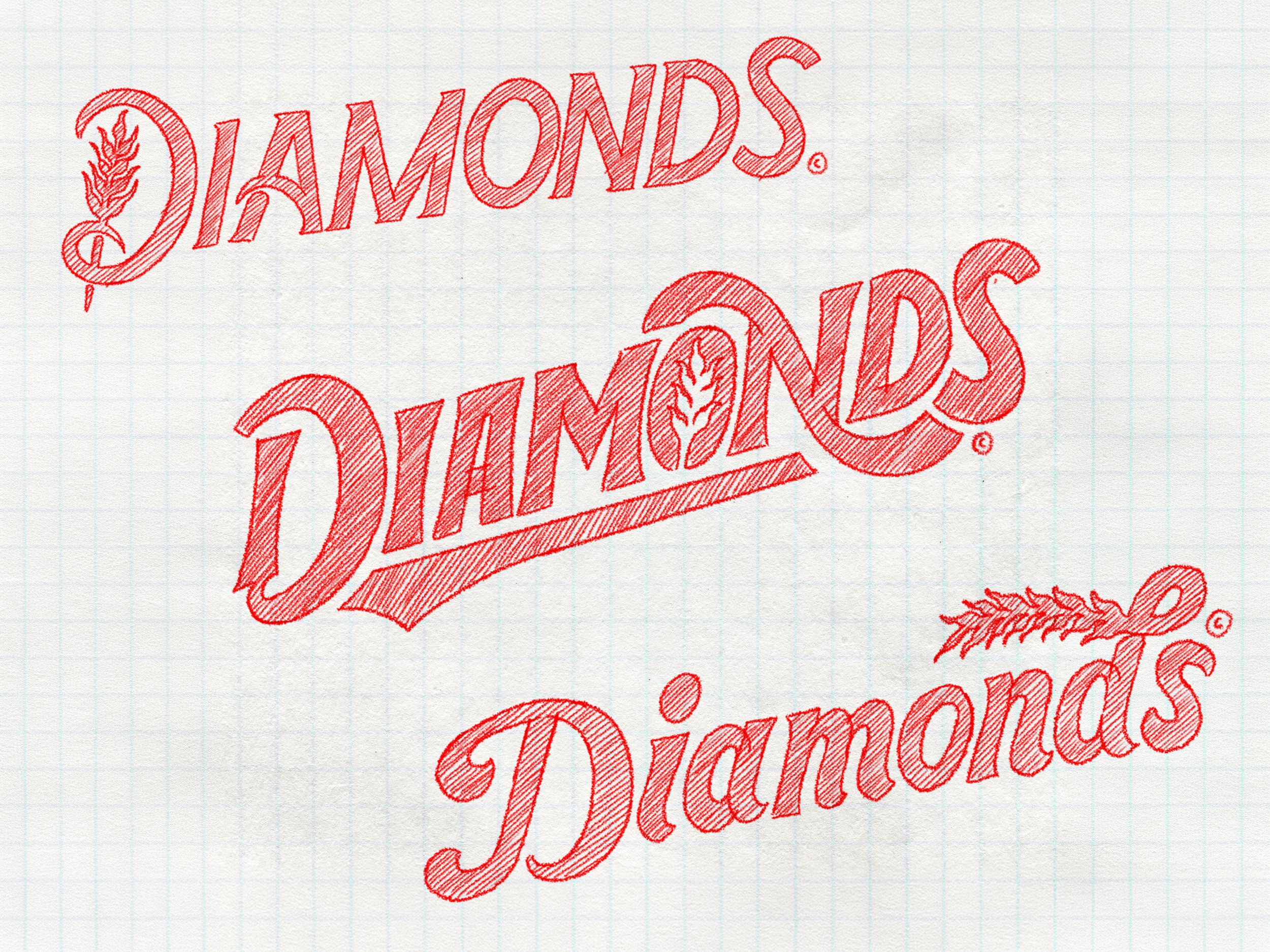 Red embroidered text on graph paper that reads "DIAMONDS" in cursive, with a small drawing of a diamond shape and a wheat stalk.