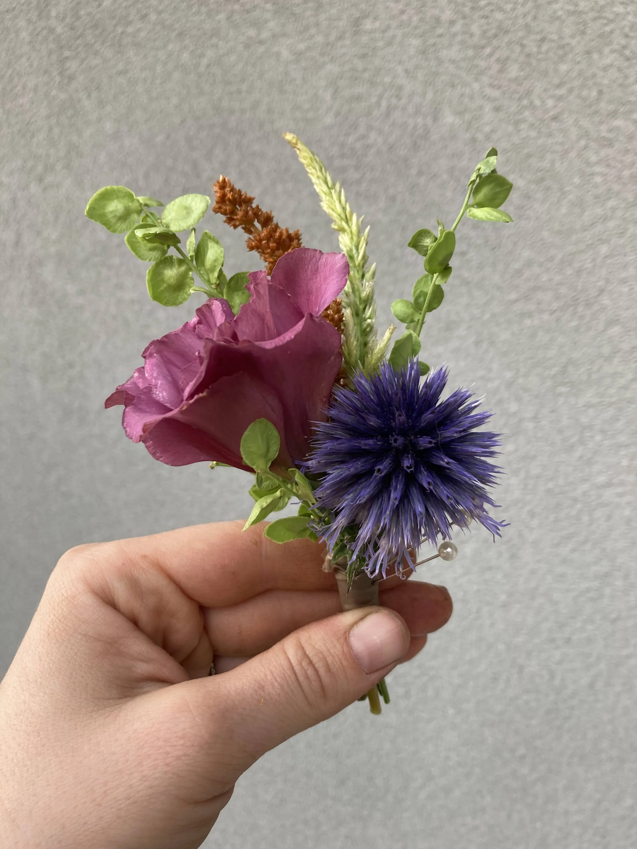 Boutonniere made from lisianthus, echinops