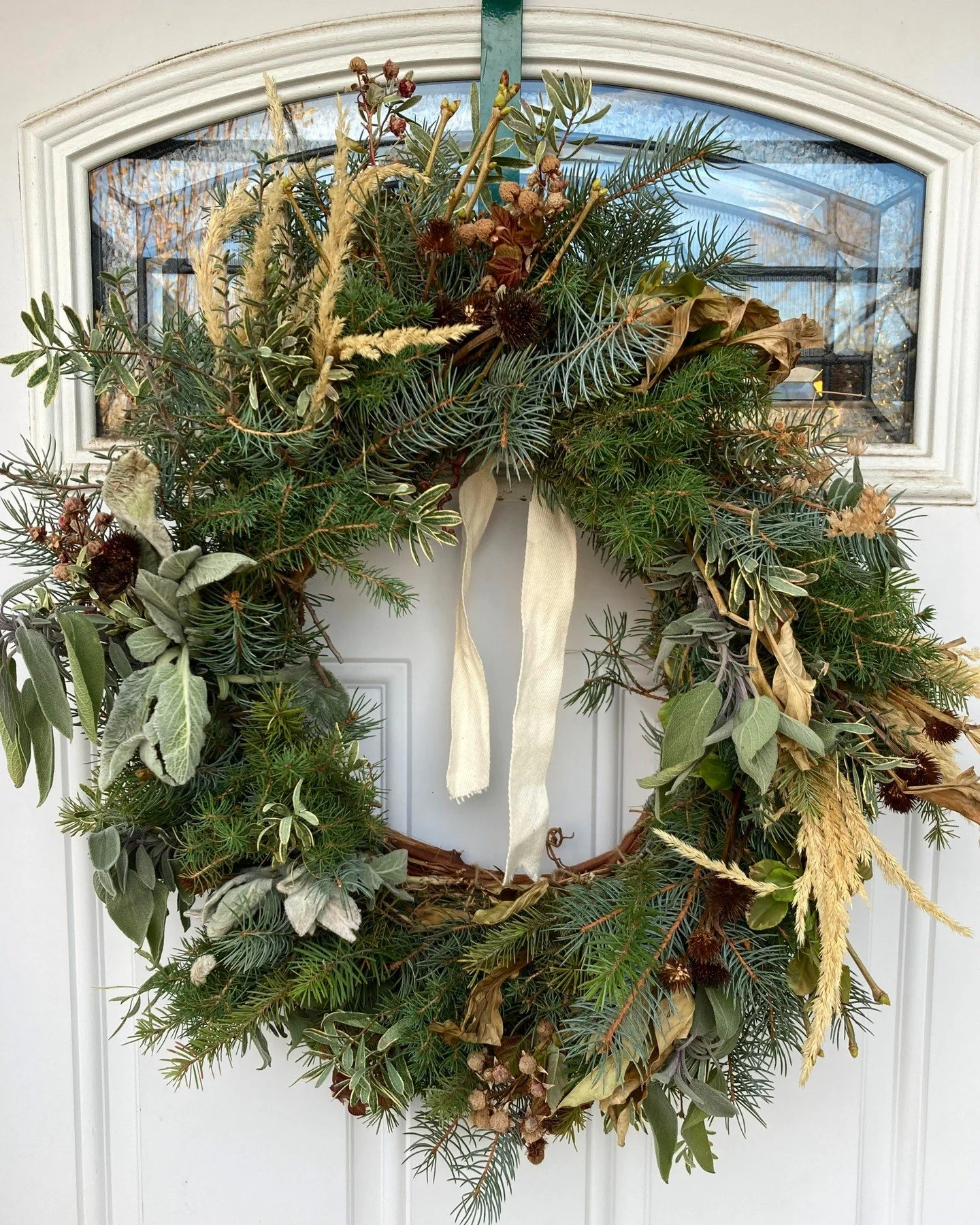 This pretty winter wreath went out this week. It is the best feeling to be part of decorating your spaces. Our winter wreaths are for sale to southwest metro Denver on our website. 
The base is made of grapevines harvested and twisted by me, and the 