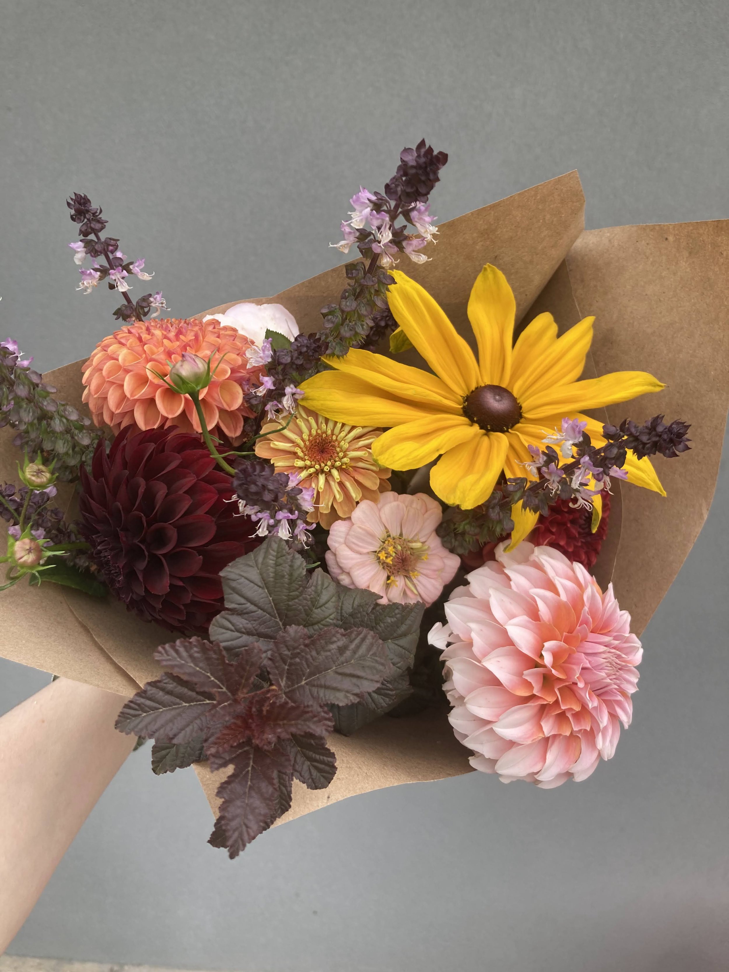 Fall flower bouquet with dahlias, ninebark, rudbeckia, basil and zinnias