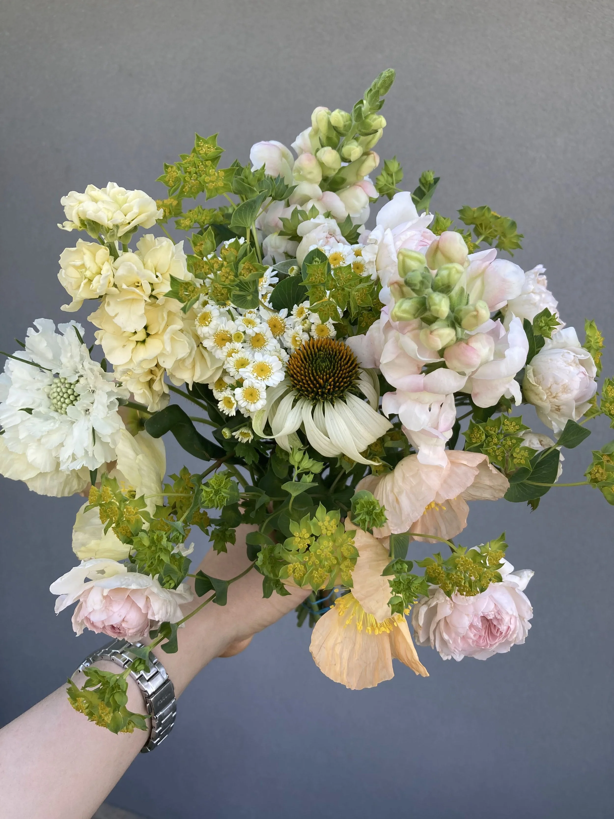Flower bouquet with echinacea, stock, iceland poppies, snapdragons, feverfew and roses