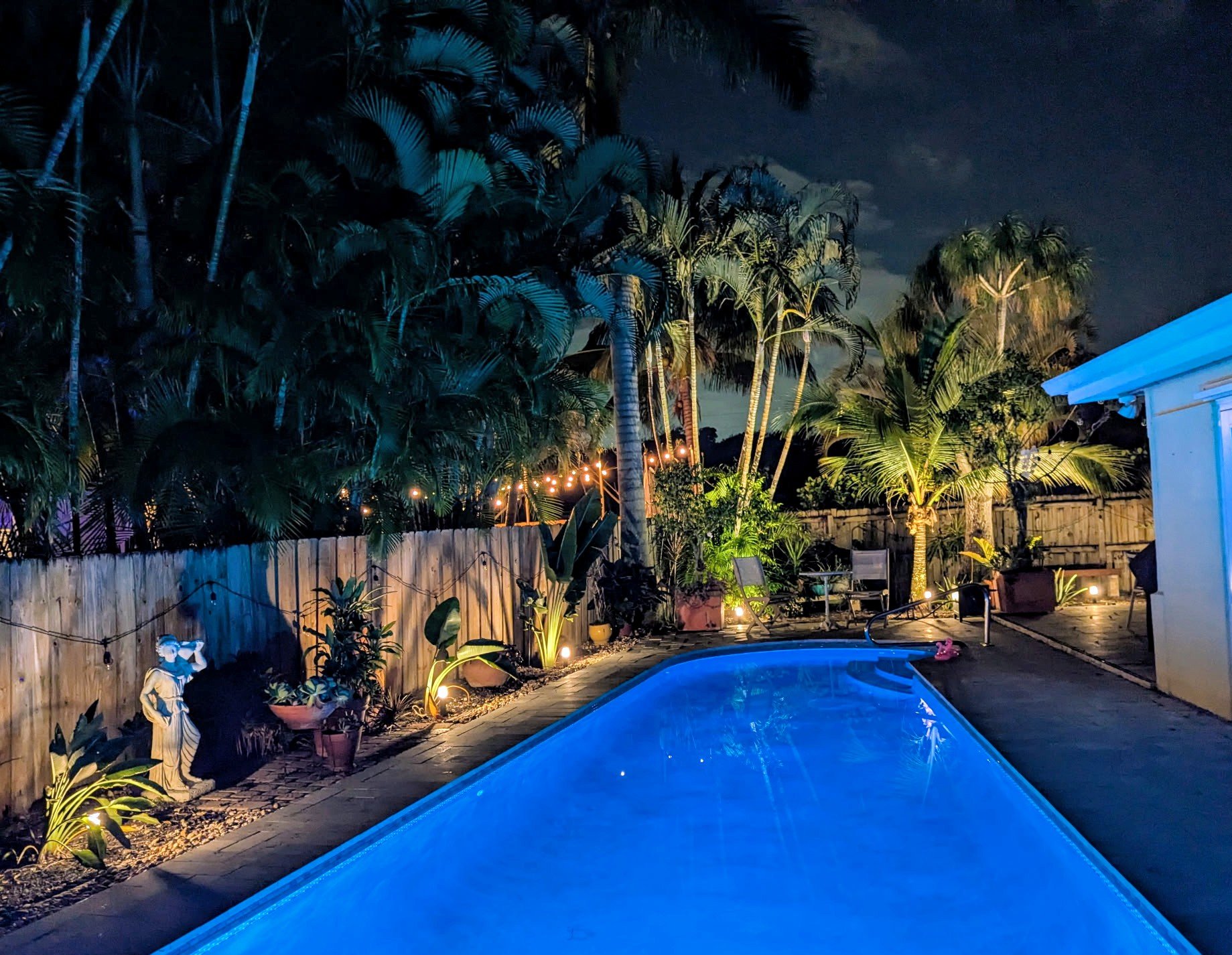 Sit outside day or night to enjoy the private backyard. 