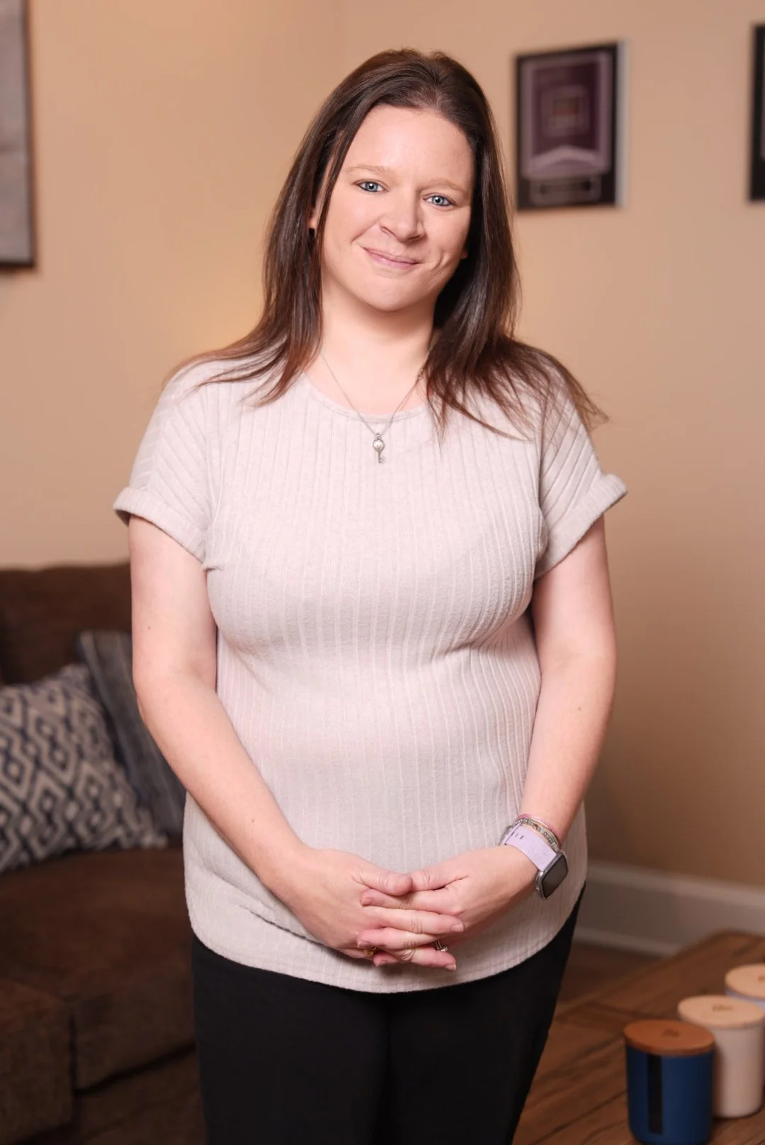 a women standing smiling at the camera at Maven law, LLC