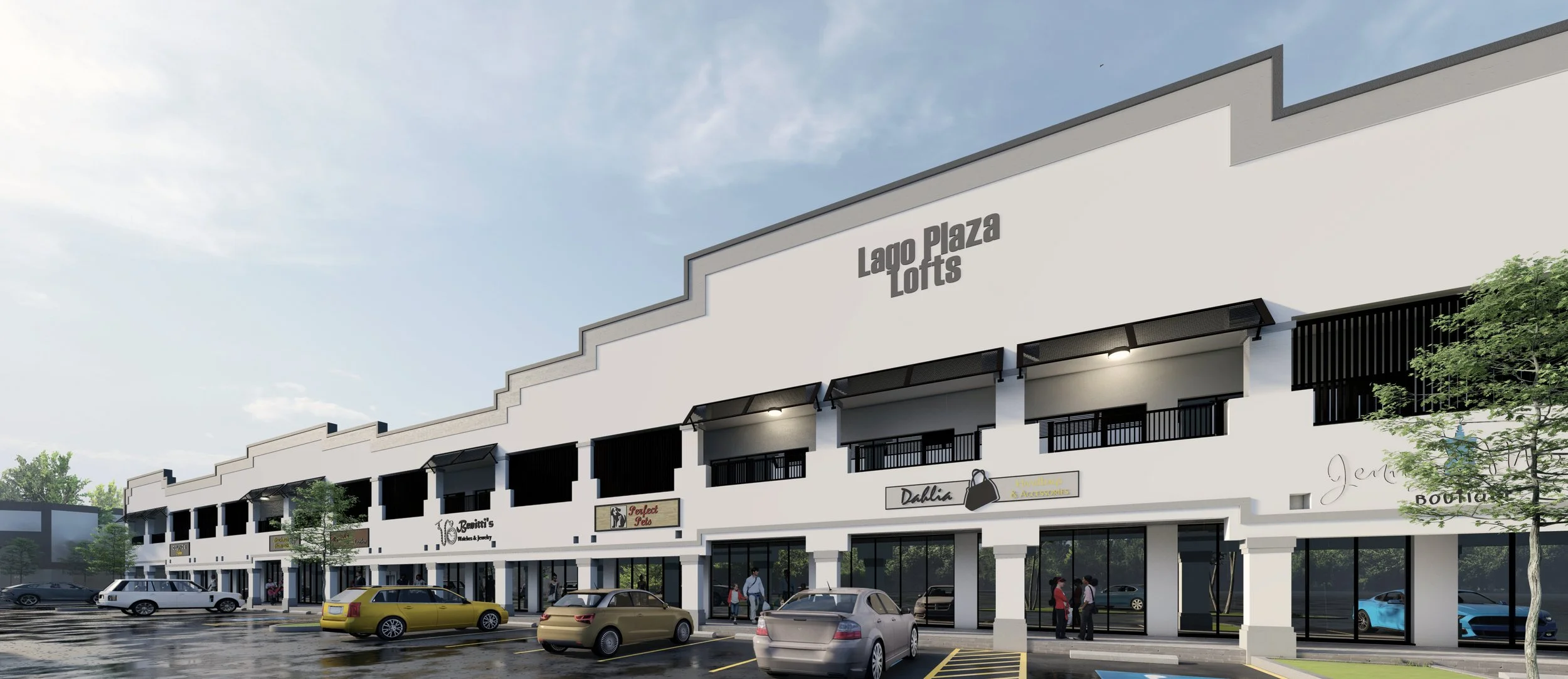 Modern commercial building with shops and parked cars in front, clear sky, and trees.